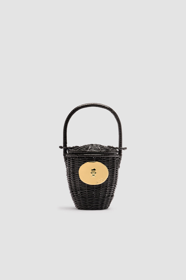 Patou - Panier seau en osier - Black - Panier en osier noir. Forme seau avec couvercle coulissant sur la anse. Décoration dorée inspirée par la "Bocca della Verità".Ce panier est réalisé artisanalement. Il peut présenter quelques irrégularités.