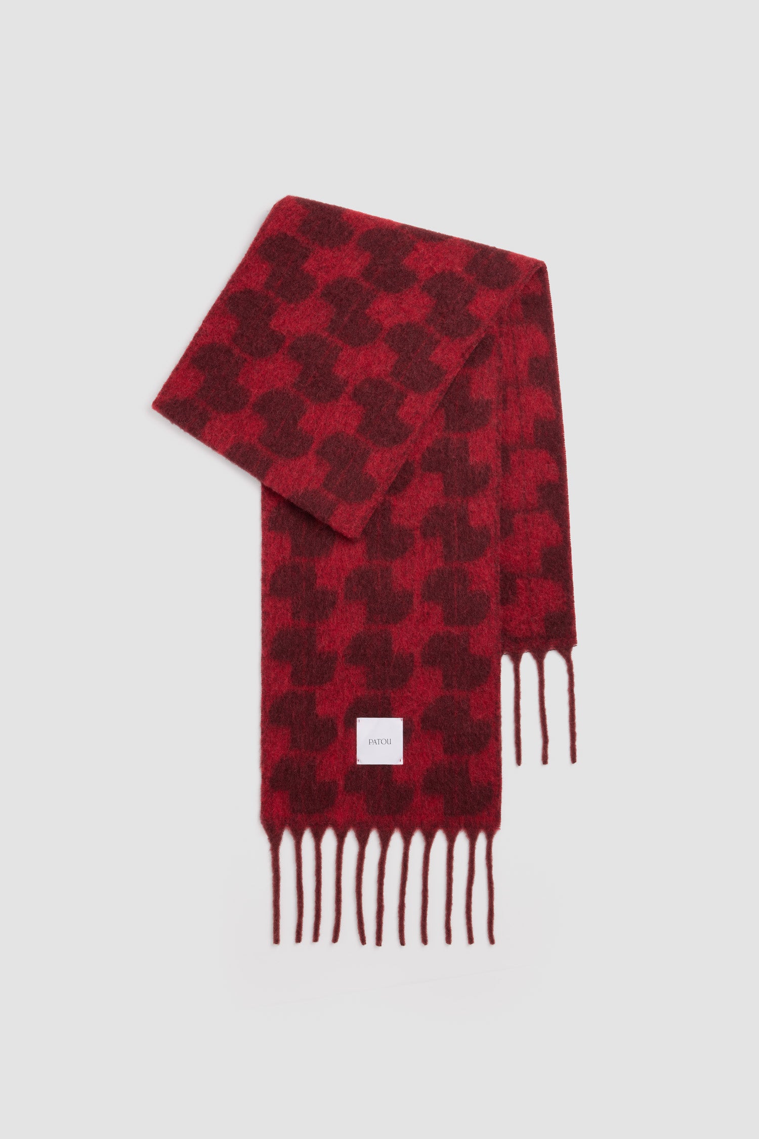 Patou - Sciarpa con monogramma JP in misto lana di alpaca - Vignola - Sciarpa in misto lana di alpaca bordeaux Vignola. Motivo JP all-over. Bordi con frange. Etichetta quadrata con logo Patou.