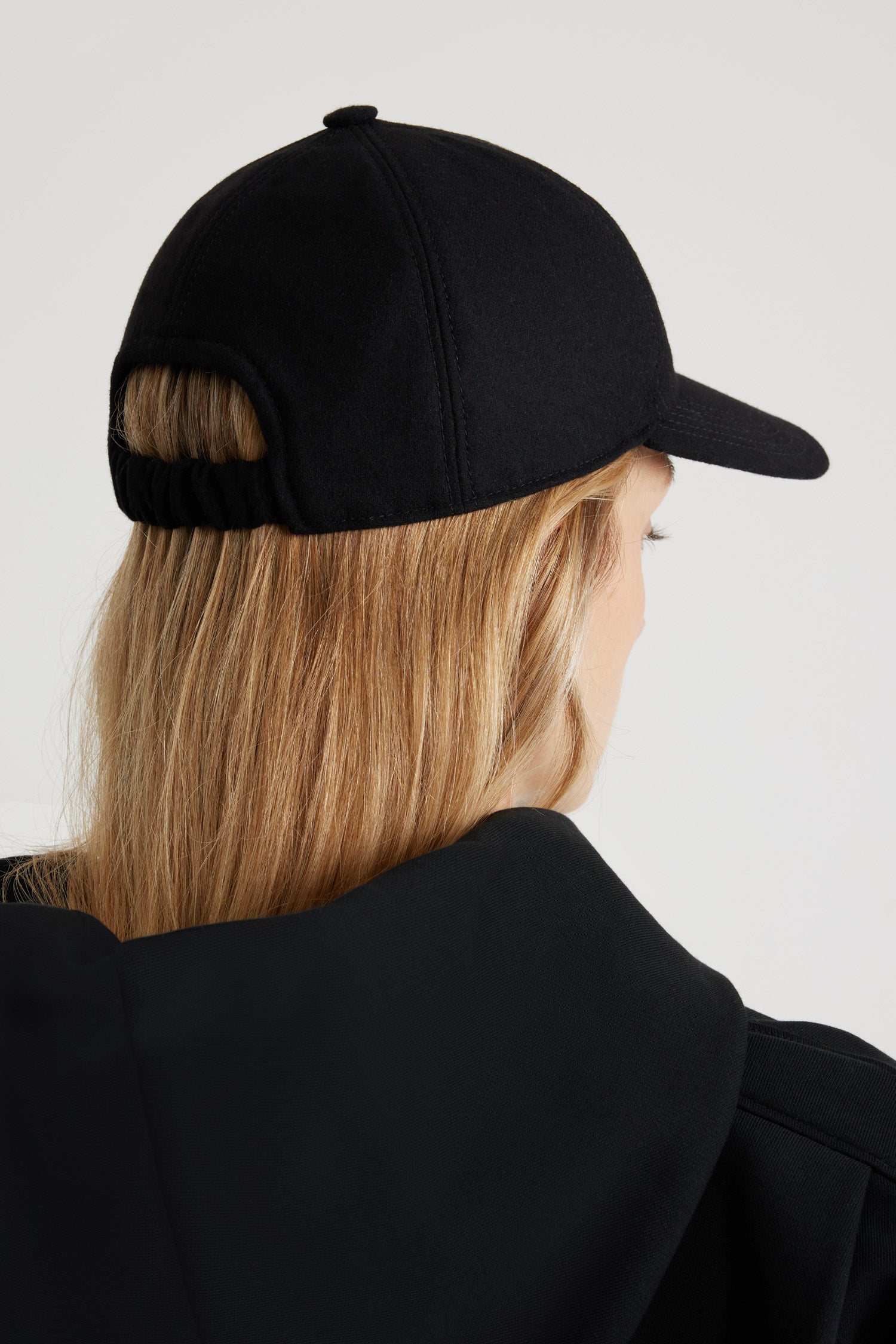 Patou - JP cap in sustainable wool blend - Black - Black sustainable wool blend baseball hat. JP bouclette patch at the side. Elasticated strap at the back. Unisex style.Sizing:S: 55 cm circumferenceM: 57 cm circumferenceL: 59 cm circumference