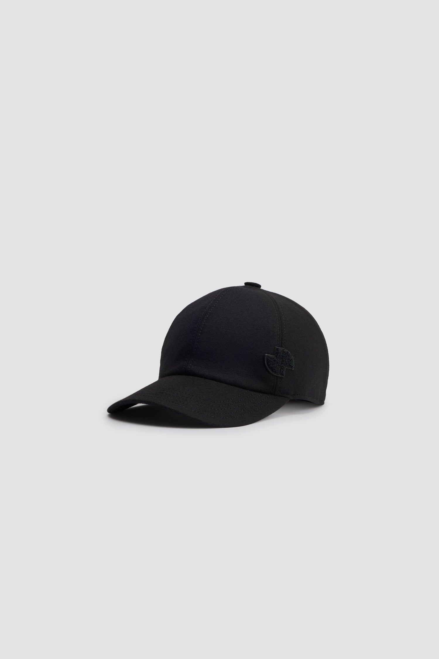 Patou - JP cap in sustainable wool blend - Black - Black sustainable wool blend baseball hat. JP bouclette patch at the side. Elasticated strap at the back. Unisex style.Sizing:S: 55 cm circumferenceM: 57 cm circumferenceL: 59 cm circumference