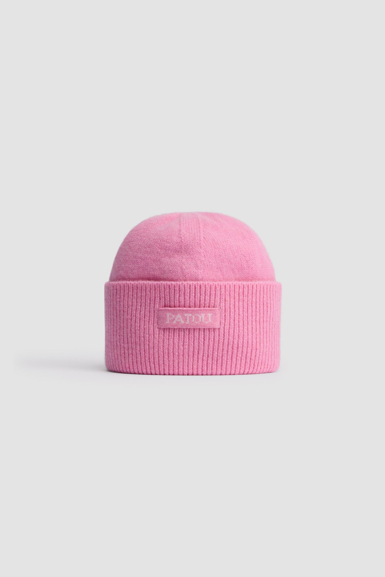 Patou - Patou beanie in sustainable wool and cashmere - Rosebloom Pink - Rosebloom Pink sustainable wool and cashmere beanie. Plain and rib knit. Patou jacquard label at the front.