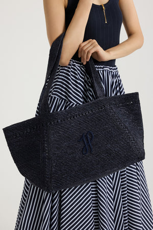 Large JP monogram trapeze tote in raffia