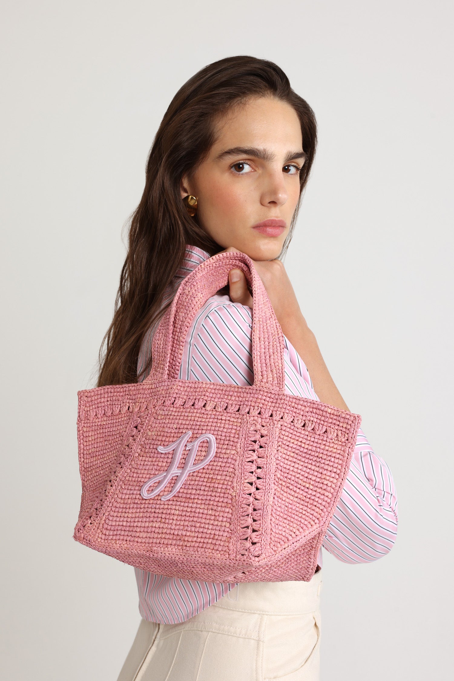 Patou - Small JP monogram trapeze tote in raffia - Primrose Pink - Primrose Pink raffia tote. Small version. Trapeze shape. Two shoulder straps. Tonal JP monogram embroidery at the front.This style was lovingly handcrafted by one of the artisans trained at the Ecole des Savoir Faire.