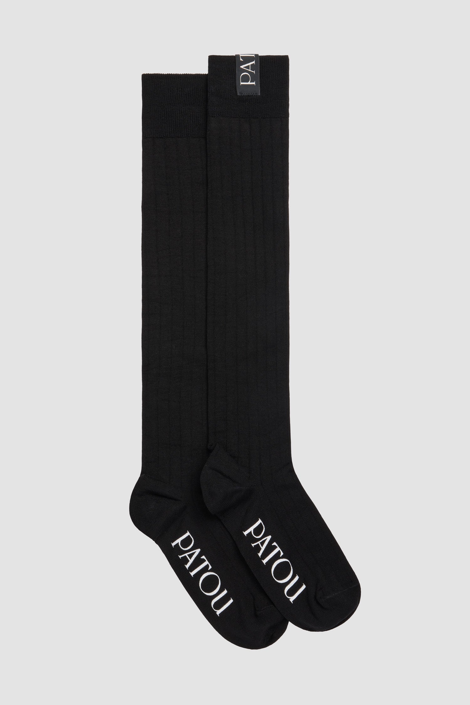 Patou - Calze al ginocchio a costine in misto cotone - Black - Calze in misto cotone nero. Maglia a costine. Altezza al ginocchio. Etichetta con logo Patou sul risvolto, jacquard con logo Patou sulla suola.