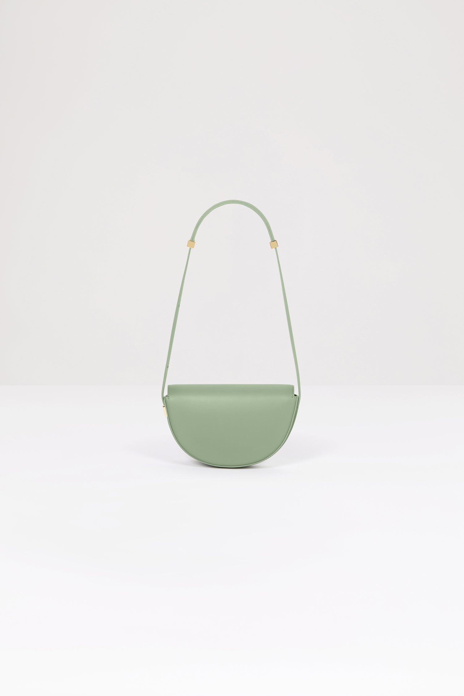 Patou - Le Petit Patou bag in leather - Dark Almond - A smaller take on everyone's favourite piece of Patou!Dark Almond green leather handbag. Crafted using unique materials sourced from unused high-quality leather hides. 80 limited numbered edition. Half-circle shape with geometric cut-outs inspired by the JP monogram. Gold-tone hardware with Patou-engraved detail at the side. Adjustable strap that allows it to be worn on the shoulder, across the body or carried by hand. Magnetic closure with gold-tone JP detail. Internal compartment. Eco lining.Measures: 20cm (length), 13cm (height), 5cm (depth)