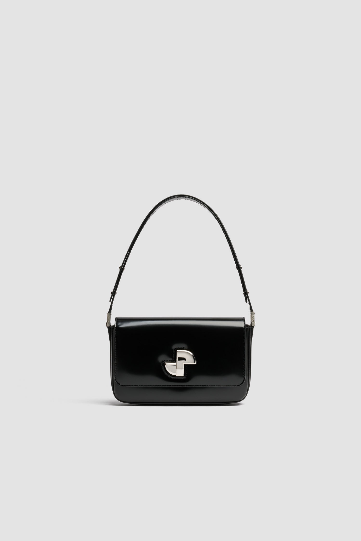 Patou - Le Classic Lock レザーバッグ - Black - ブラックのつややかなレザー製ハンドバッグ。ひねりを効かせた、クラシックなデイバッグ。フロントにゴールドのアールデコ調JPツイストクラスプ。肩掛けまたは手持ちのどちらでも持ち運べる調節可能なストラップ付き。レザーライニング。