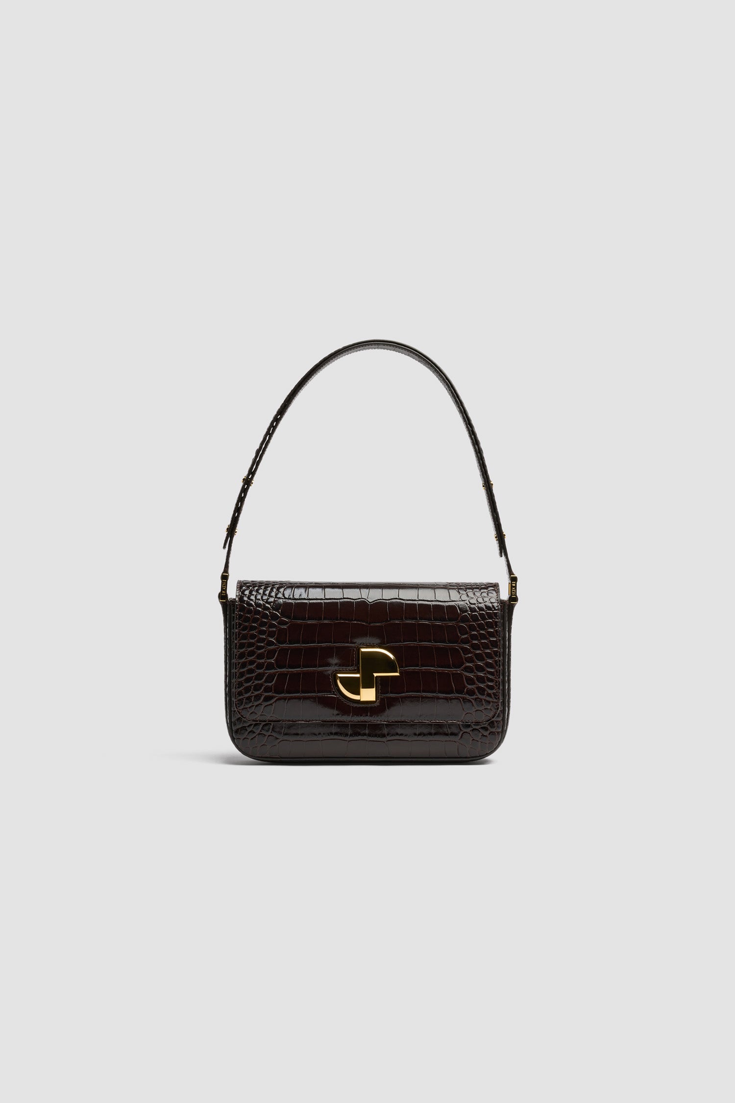 Patou - Borsa Le Classic Lock in pelle di coccodrillo goffrata - Smoked Ebony - Borsa in pelle di coccodrillo goffrata Smoked Ebony. Borsa da giorno classica rivisitata. Fermaglio girevole JP oro in stile Art Déco sul davanti. Tracolla regolabile che può essere indossata lunga o corta. Fodera in pelle.