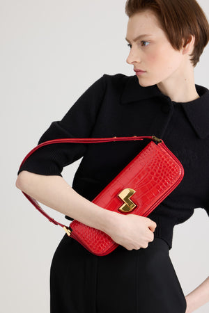 Le Lock Baguette bag in crocodile-embossed leather