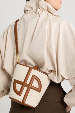 Small JP bucket bag in leather and canvas