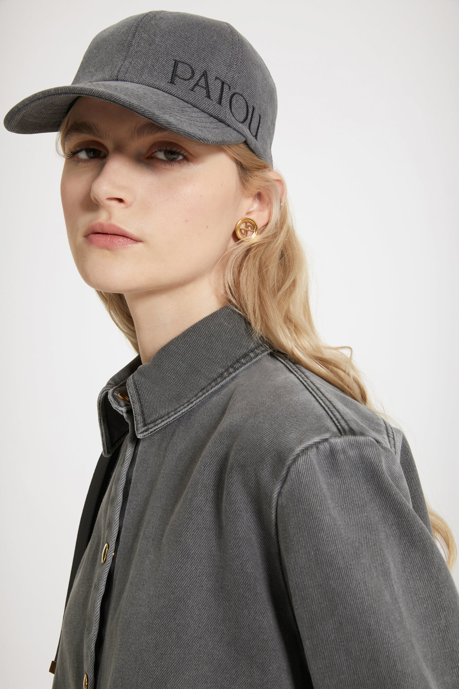 Patou - Cut-out cropped shirt in organic cotton denim - Anthracite - A denim shirt with a difference.Anthracite grey organic cotton denim shirt. Sustainable laser fading. Cropped silhouette with violin-shaped cut-outs at the sides. Gold-tone press buttons at the front and cuffs. Embroidered Patou logo at the front. Pleating at the cuffs.
