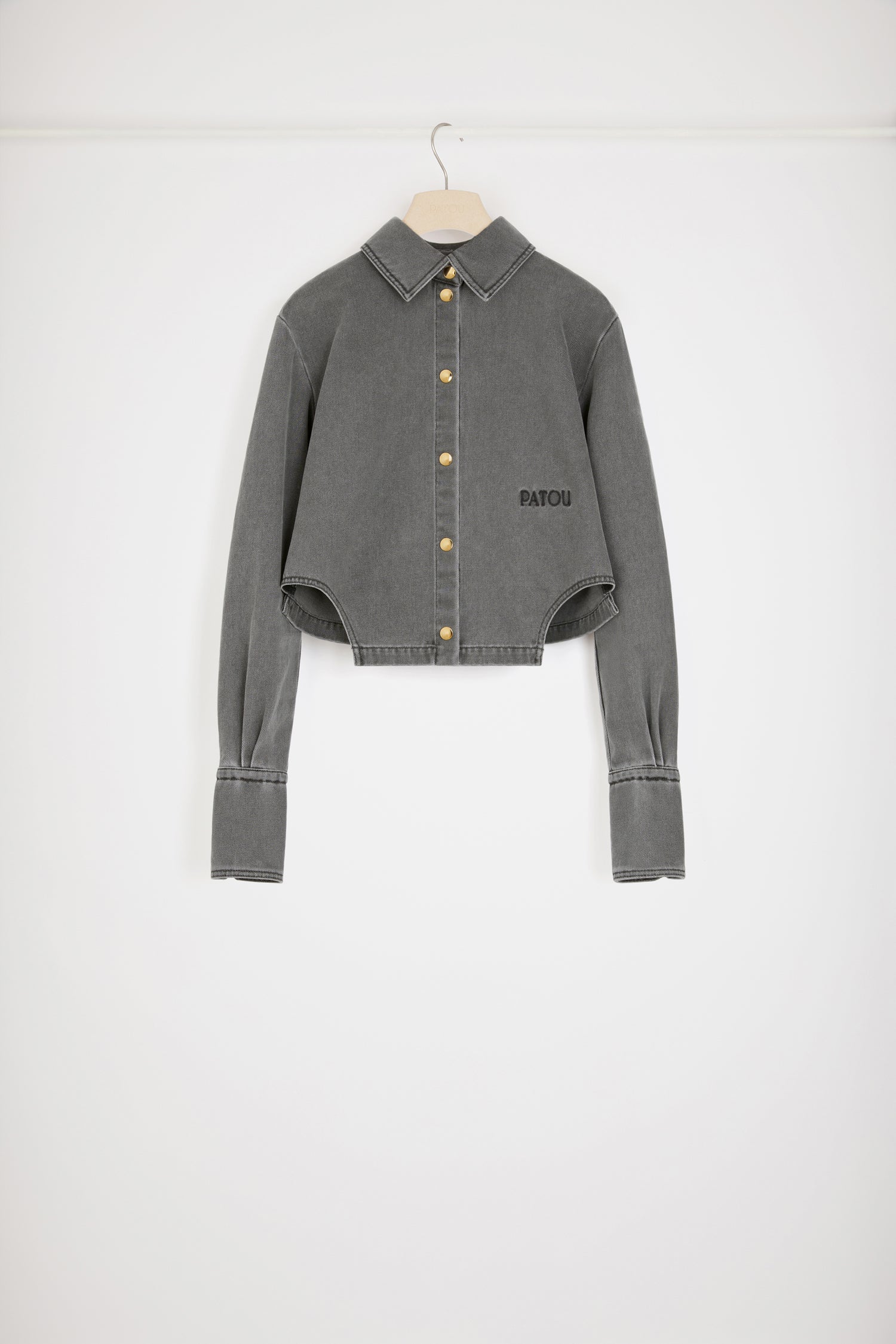 Patou - Cut-out cropped shirt in organic cotton denim - Anthracite - A denim shirt with a difference.Anthracite grey organic cotton denim shirt. Sustainable laser fading. Cropped silhouette with violin-shaped cut-outs at the sides. Gold-tone press buttons at the front and cuffs. Embroidered Patou logo at the front. Pleating at the cuffs.