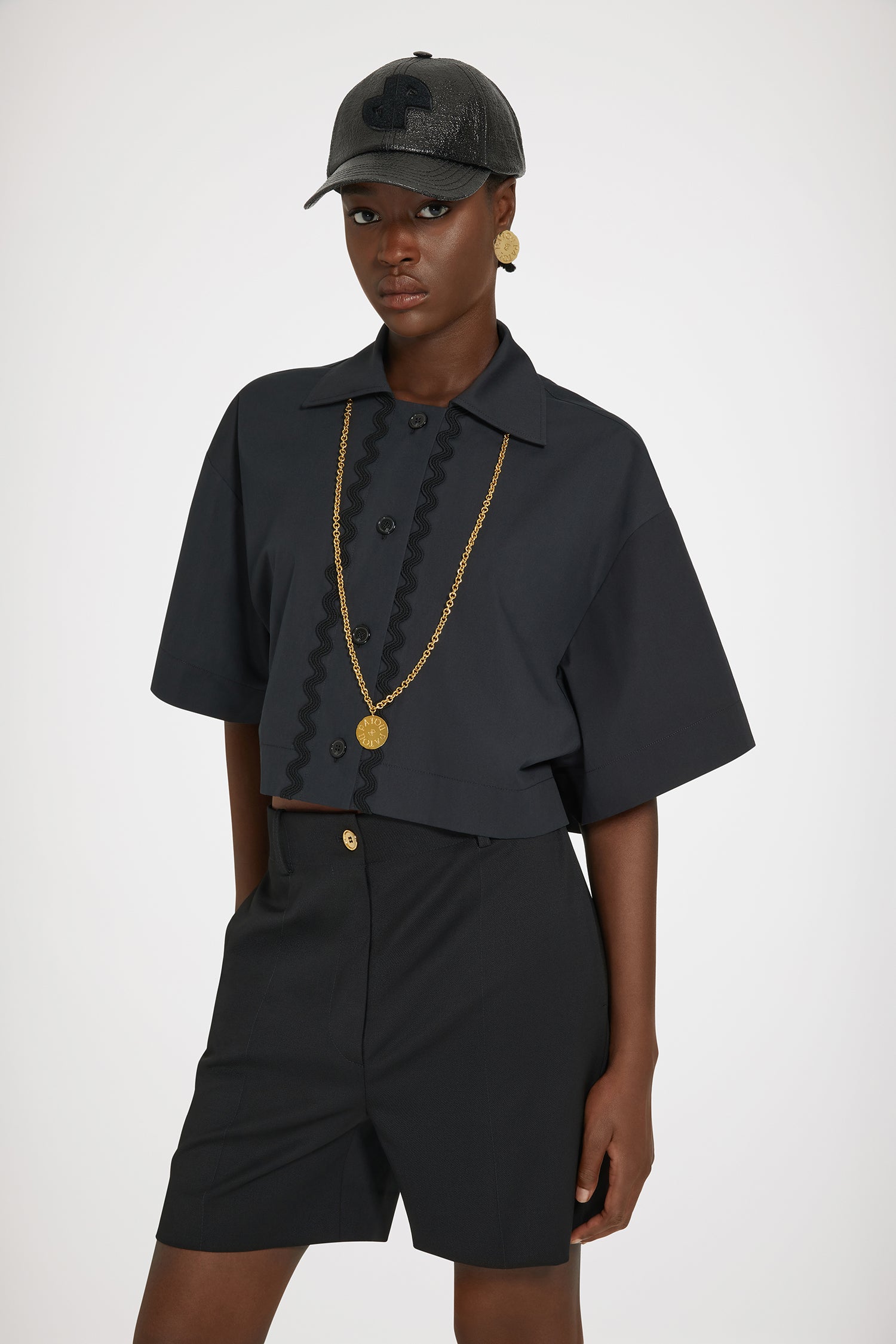 Patou - Wave cropped shirt in sustainable cotton - Black - The art of the subtle embellishment.Black sustainable cotton poplin blouse. Boxy fit. Cropped length. Shirt collar. JP-engraved buttons. Wave trims down the front.This oversized style was designed for a cropped and wide fit.