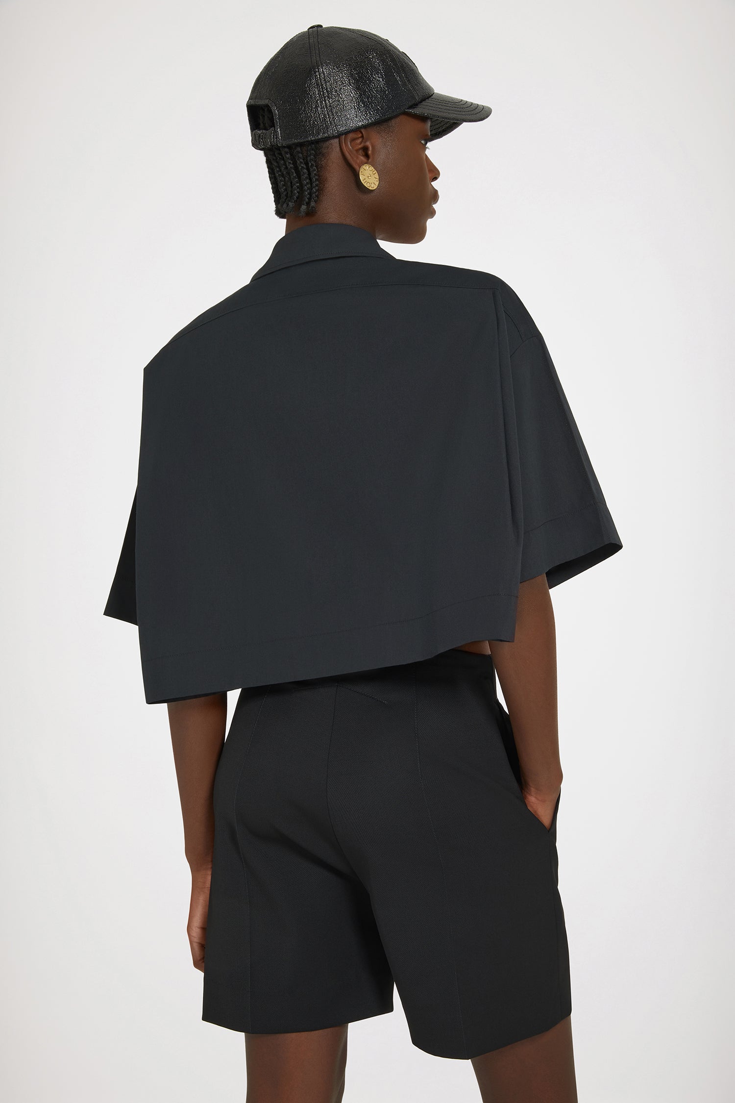Patou - Wave cropped shirt in sustainable cotton - Black - The art of the subtle embellishment.Black sustainable cotton poplin blouse. Boxy fit. Cropped length. Shirt collar. JP-engraved buttons. Wave trims down the front.This oversized style was designed for a cropped and wide fit.