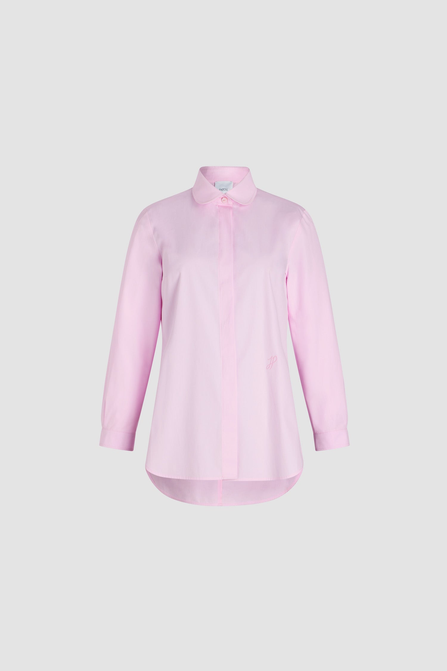 Patou - Tailored shirt in organic cotton poplin - Primrose Pink - Primrose Pink organic cotton poplin shirt. Peter Pan collar. Concealed button front fastening. Cropped sleeves with buttoned cuffs. Embroidered JP calligraphy monogram at the front. Asymmetric front to back hem.