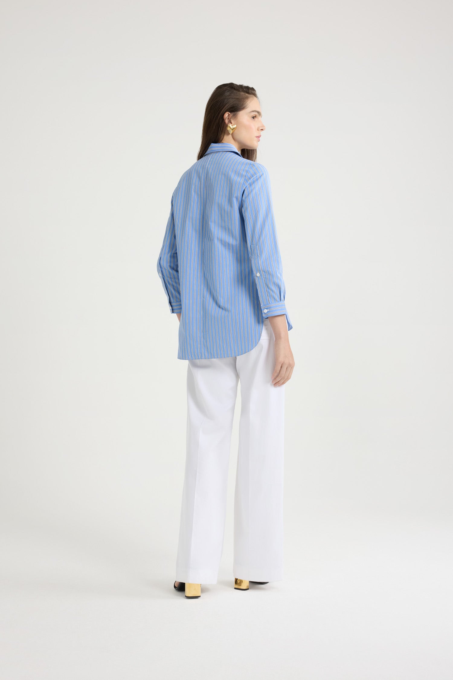 Patou - Tailored shirt in printed organic cotton poplin - Heritage Blue Stripes - Heritage Blue organic cotton poplin shirt. Striped pattern. Peter Pan collar. Concealed button front fastening. Cropped sleeves with buttoned cuffs. Embroidered JP calligraphy monogram at the front. Asymmetric front to back hem.