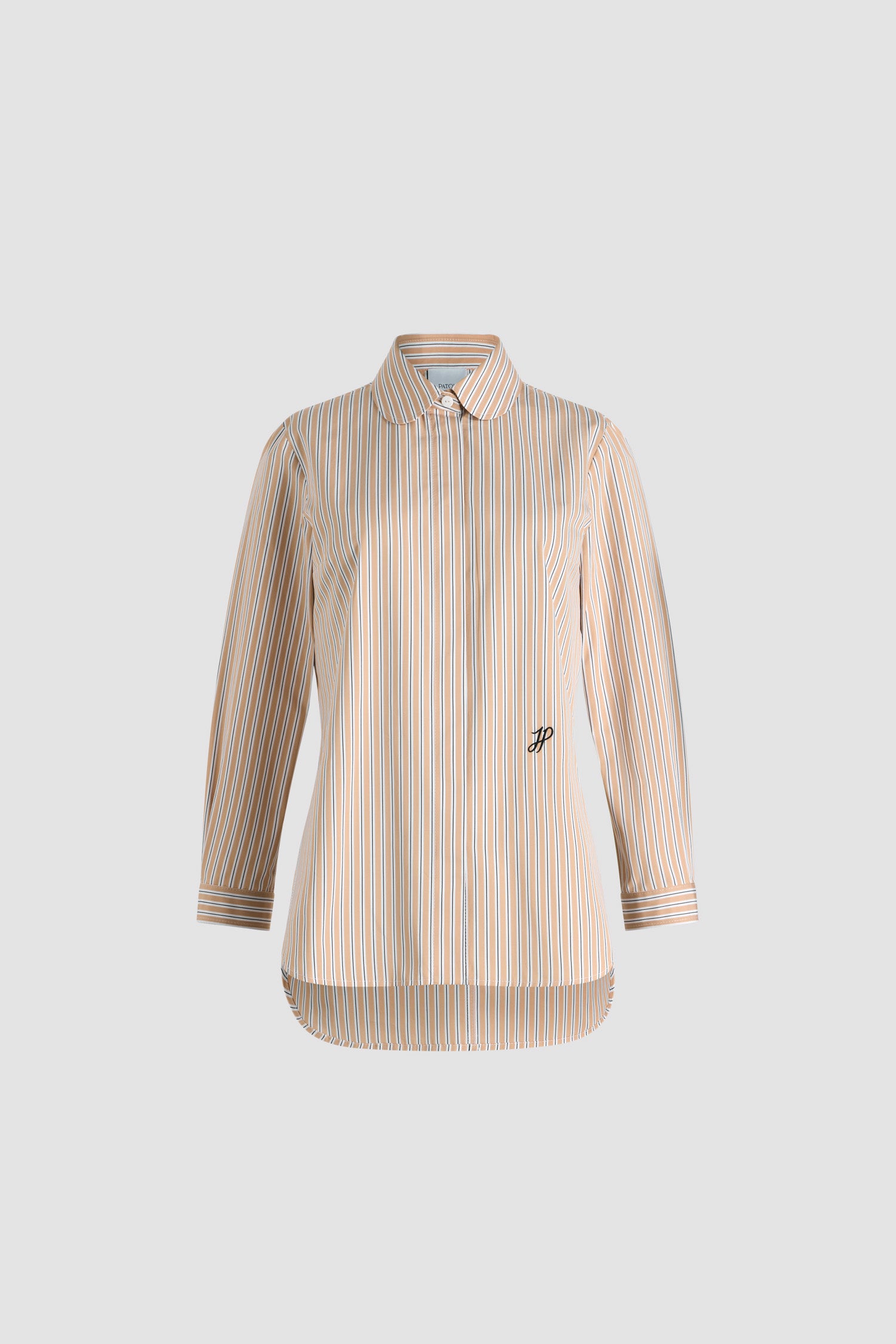 Patou - Tailored shirt in printed organic cotton poplin - Beige Stripes - Beige organic cotton poplin shirt. Striped pattern. Peter Pan collar. Concealed button front fastening. Cropped sleeves with buttoned cuffs. Embroidered JP calligraphy monogram at the front. Asymmetric front to back hem.