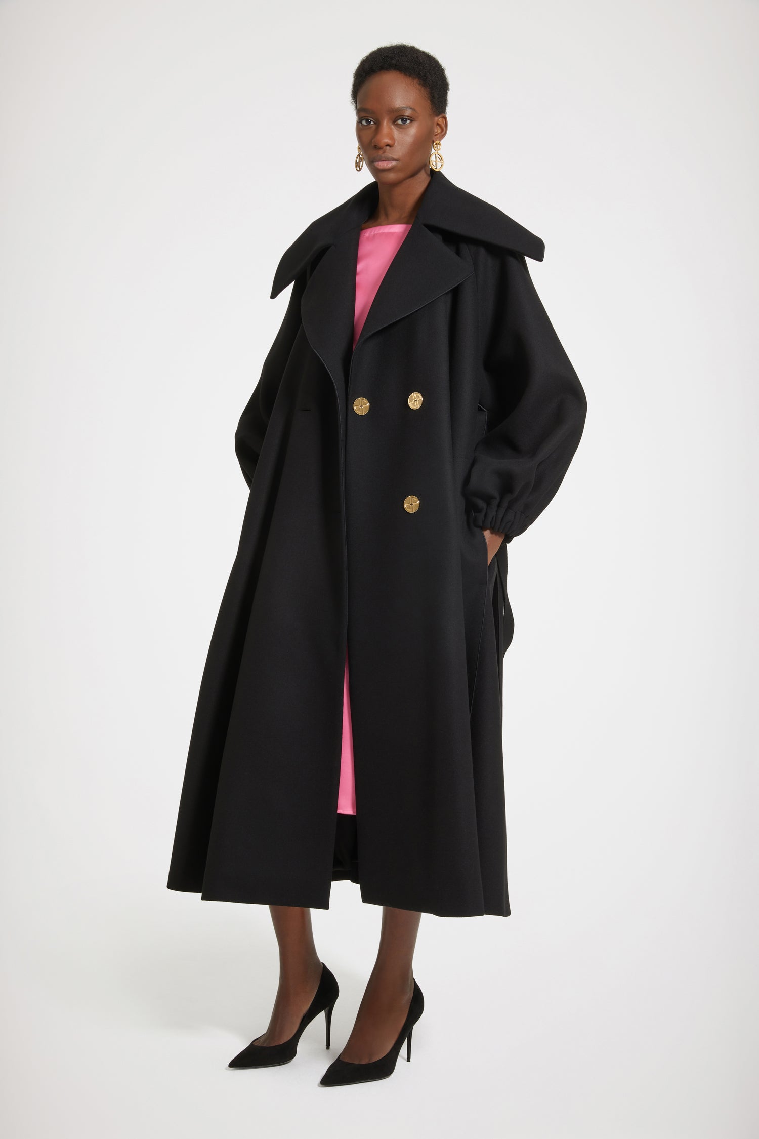 Patou - Oversized statement coat in wool-blend felt - Black - The volume we crave, the coat we deserve.Black wool-blend felt coat. Oversized silhouette. Double-breasted style. Exaggerated lapels. Art Deco-style gold-tone JP-engraved buttons. Removable belt. Volume sleeves. Elasticated cuffs. Pockets at the sides. Satin stitch hem detail all over. Fully lined.