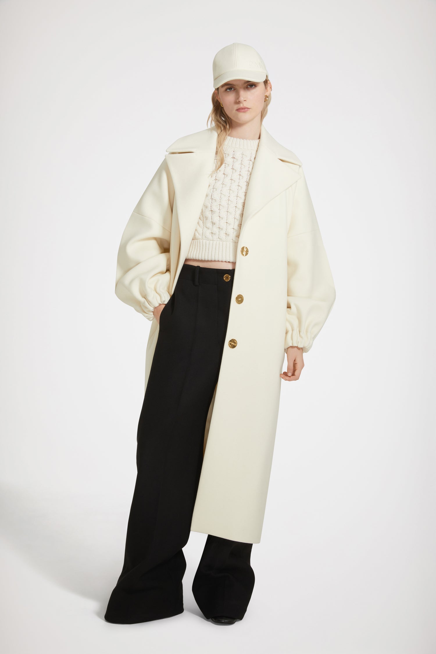 Patou - Cocoon coat in wool-blend felt - Avalanche - The soft embrace of a Patou coat.Avalanche white wool-blend felt coat. Soft cocoon silhouette. Notch lapels. Art Deco-style gold-tone JP-engraved buttons. Volume sleeves. Elasticated cuffs. Pockets at the sides. Fully lined.Voluminous coat with long sleeves.