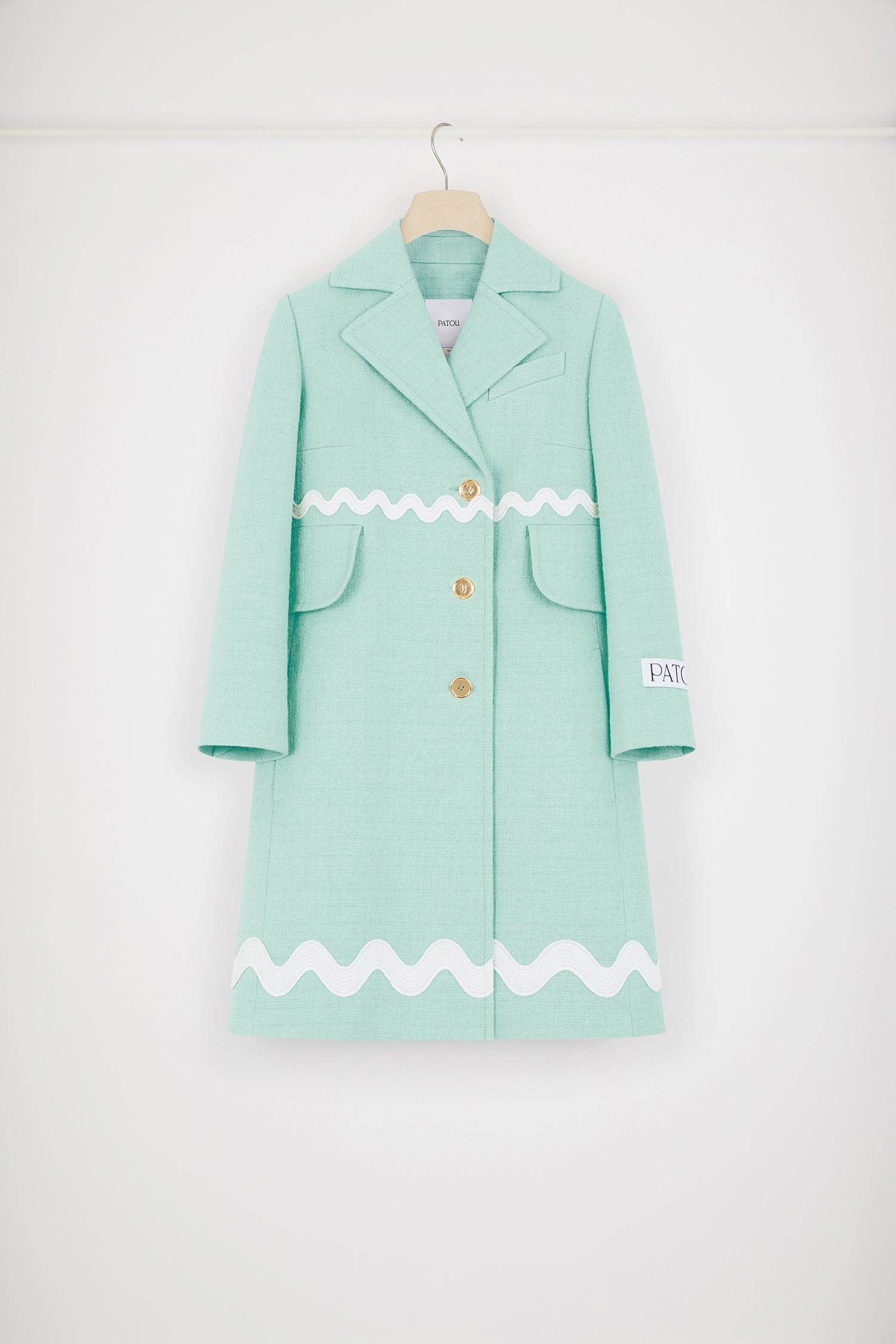 Patou - Wave summer coat in cotton tweed - Mint Green - The perfect summer layer.Mint green cotton tweed coat. Mid length. A-line silhouette. Single-breasted style with off-center placket. Notch lapels. Chest pocket. High flap pockets. Contrast wave trims. Gold-tone Patou-engraved buttons. Cropped sleeves. Patou label on the left sleeve.This style is very fitted. We suggest ordering one size up or wearing it over skintight layers.