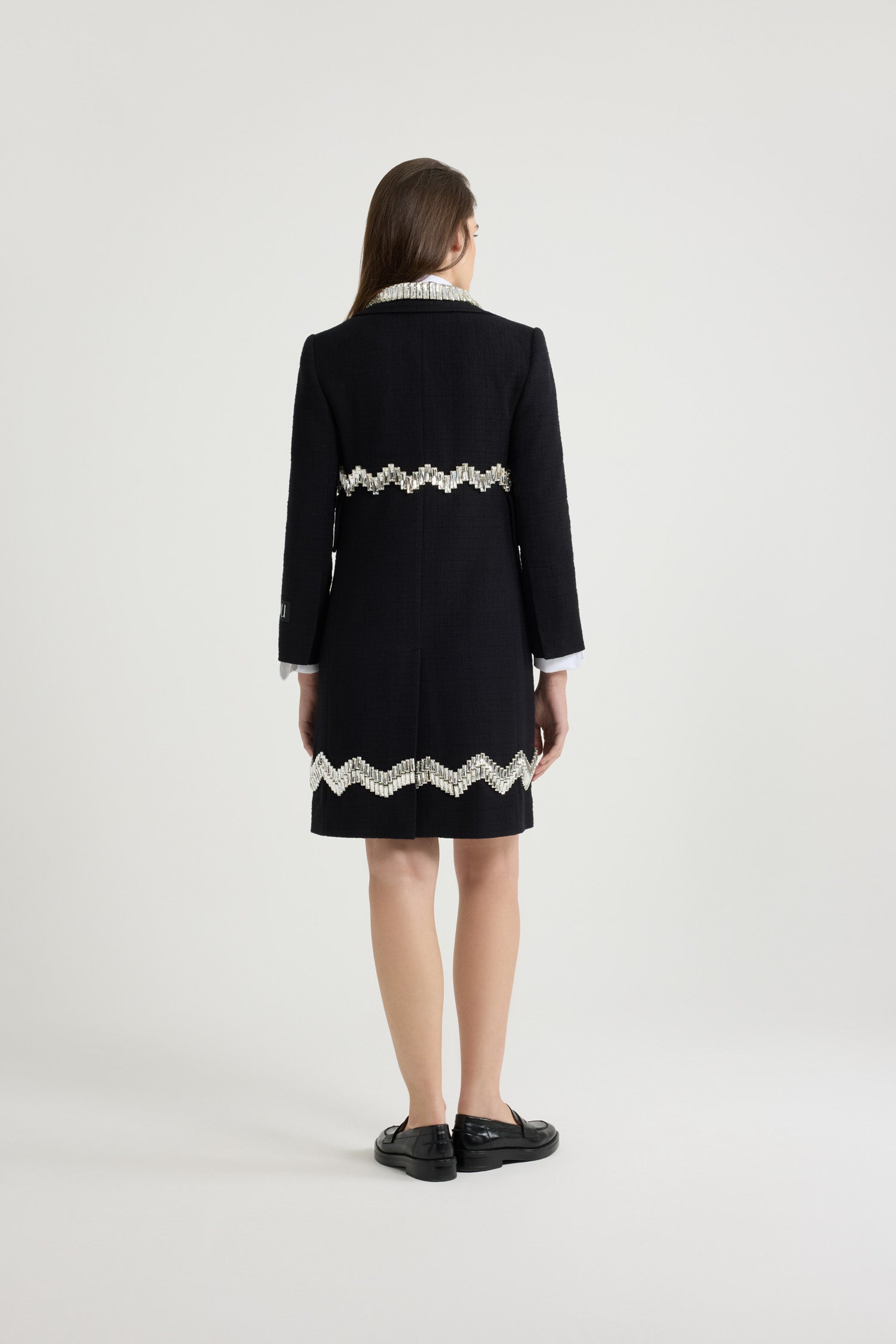 Patou - Embellished summer coat in cotton tweed - Black - The perfect summer layer.Black cotton tweed coat. Mid length. A-line silhouette. Single-breasted style with off-center placket. Crystal bead embellishments. Notch lapels. Mock chest pocket. High flap pockets. Gold-tone Patou-engraved buttons. Cropped sleeves. Patou label on the left sleeve.This style is very fitted. We suggest ordering one size up or wearing it over skintight layers.