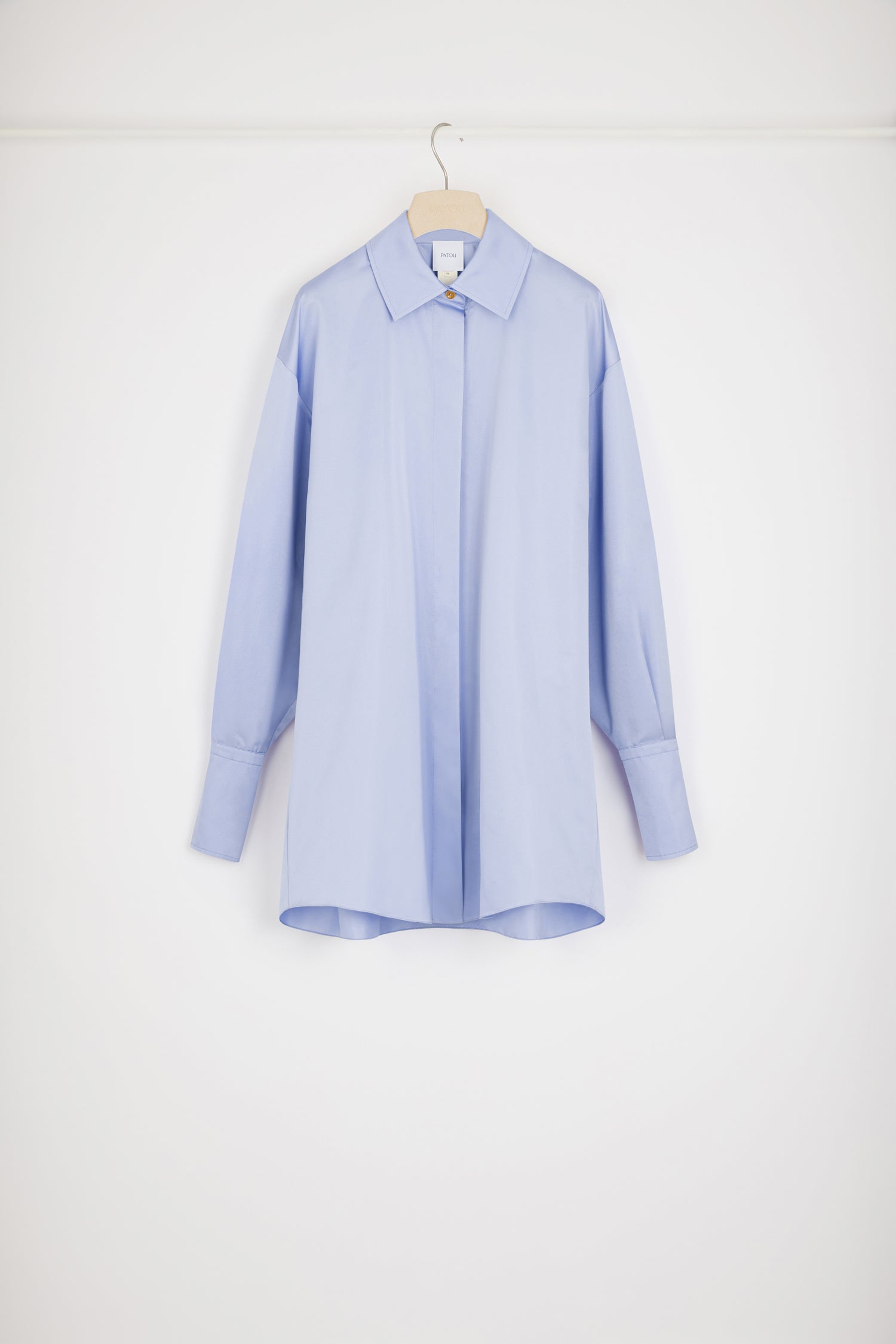 Patou - Mini shirt dress in eco-friendly satin - Alaska Blue - Layered or on its own, a new shape to make your own.Alaska Blue recycled polyester satin dress. Short length. Loose silhouette. Shirt collar. Gold-tone JP-engraved buttons. Concealed button fastening. Buttoned cuffs.Oversize style.