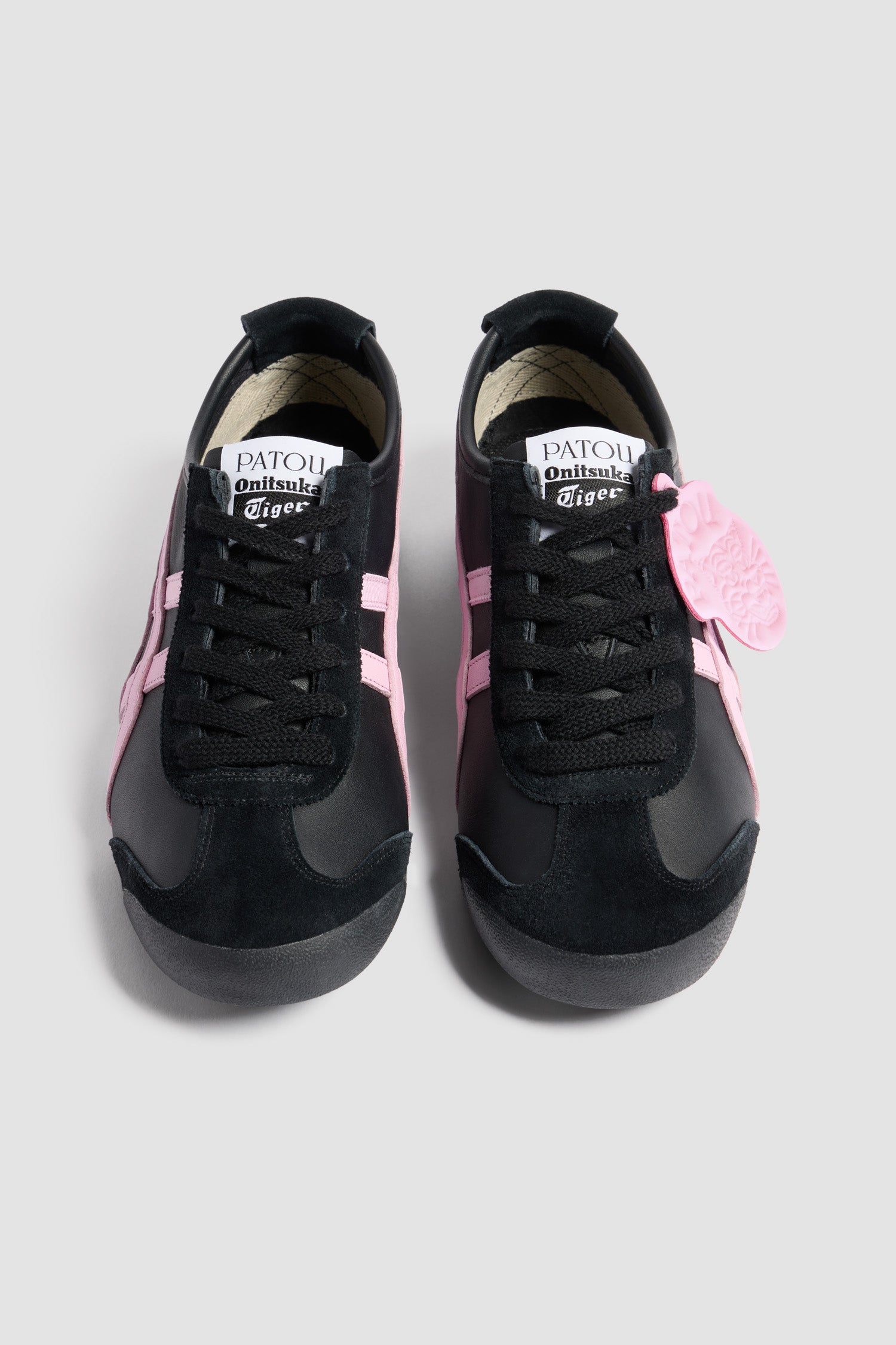 Patou - Patou x Onitsuka Tiger Mexico 66 trainers in nappa - Black - Black nappa trainers. Exclusive style from a special collaboration with Onitsuka Tiger. Iconic Mexico 66 design. Signature stripes in contrast leather and grosgrain. Contrast leather tag embossed with the Patou logo and Tiger motif. Patou and Tiger logos on the tongue and heel tab. Lace fastening. Two-tone rubber sole.