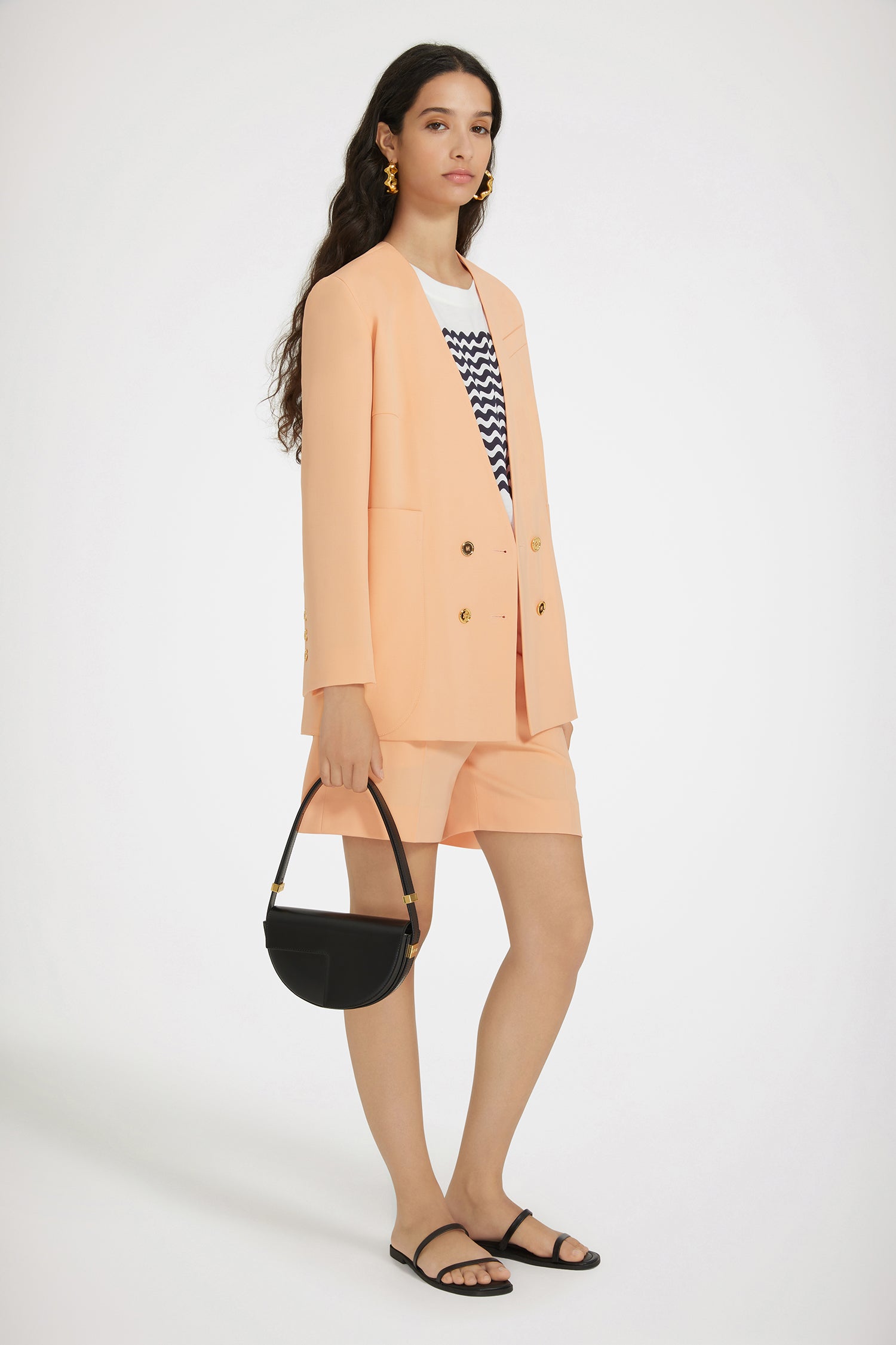 Patou - Collarless double-breasted jacket in technical wool - Light orange - The collarless (r)evolution.Light orange technical wool twill jacket. Double-breasted silhouette. Collarless design. Gold-tone JP-engraved buttons at the front and on the cuffs. Slit pocket at the chest, two oversized patch pockets. Patou label on the left sleeve. Lined.