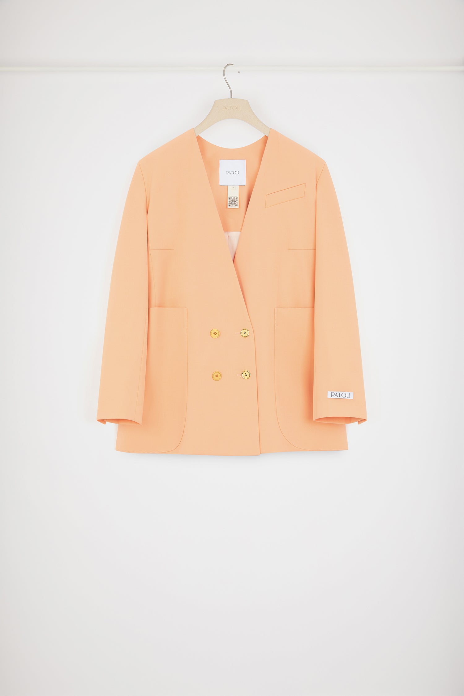 Patou - Collarless double-breasted jacket in technical wool - Light orange - The collarless (r)evolution.Light orange technical wool twill jacket. Double-breasted silhouette. Collarless design. Gold-tone JP-engraved buttons at the front and on the cuffs. Slit pocket at the chest, two oversized patch pockets. Patou label on the left sleeve. Lined.