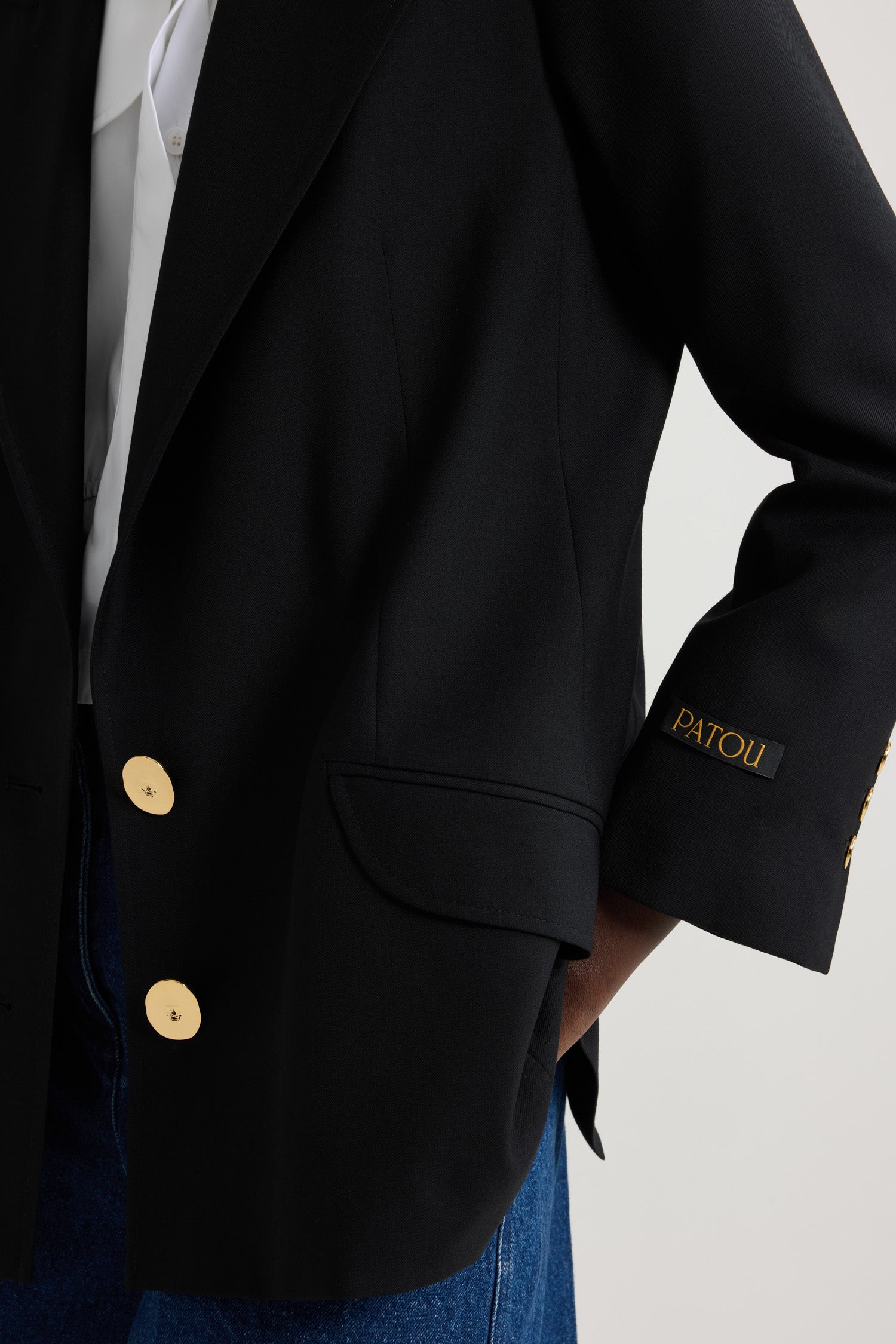 Patou - Jewellery button wool jacket - Black - Buttons sculpted into iconic masterpieces: the Patou touch.Black eco-conscious wool twill jacket. Tailored single-breasted style. Fastens via two “Bocca della Verità” brass buttons at the front. Tailor-style label with Patou logo in gold letters on the left sleeve. Engraved gold-coloured buttons on the cuffs. Two flap pockets. Fully lined.