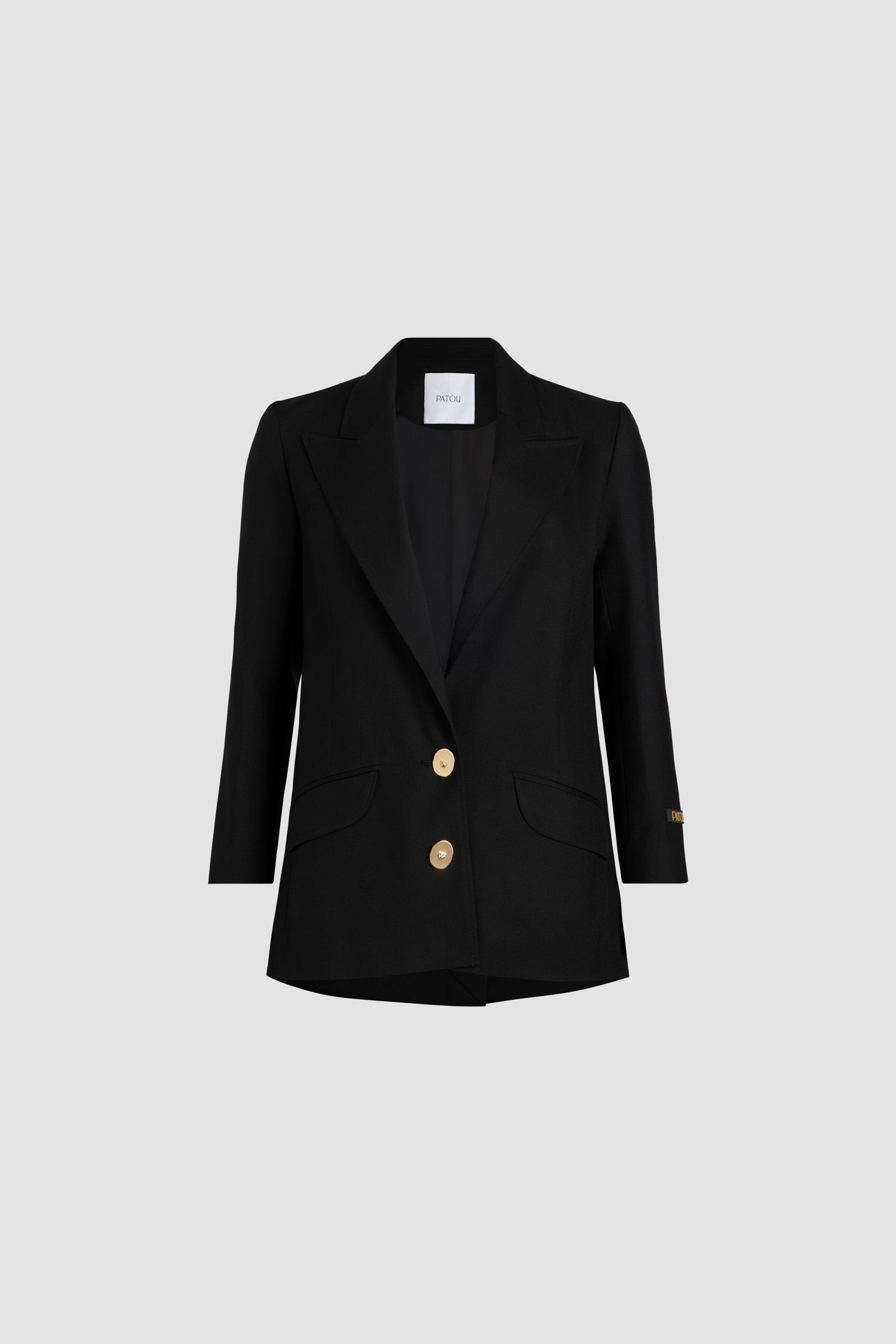 Patou - Jewellery button wool jacket - Black - Buttons sculpted into iconic masterpieces: the Patou touch.Black eco-conscious wool twill jacket. Tailored single-breasted style. Fastens via two “Bocca della Verità” brass buttons at the front. Tailor-style label with Patou logo in gold letters on the left sleeve. Engraved gold-coloured buttons on the cuffs. Two flap pockets. Fully lined.