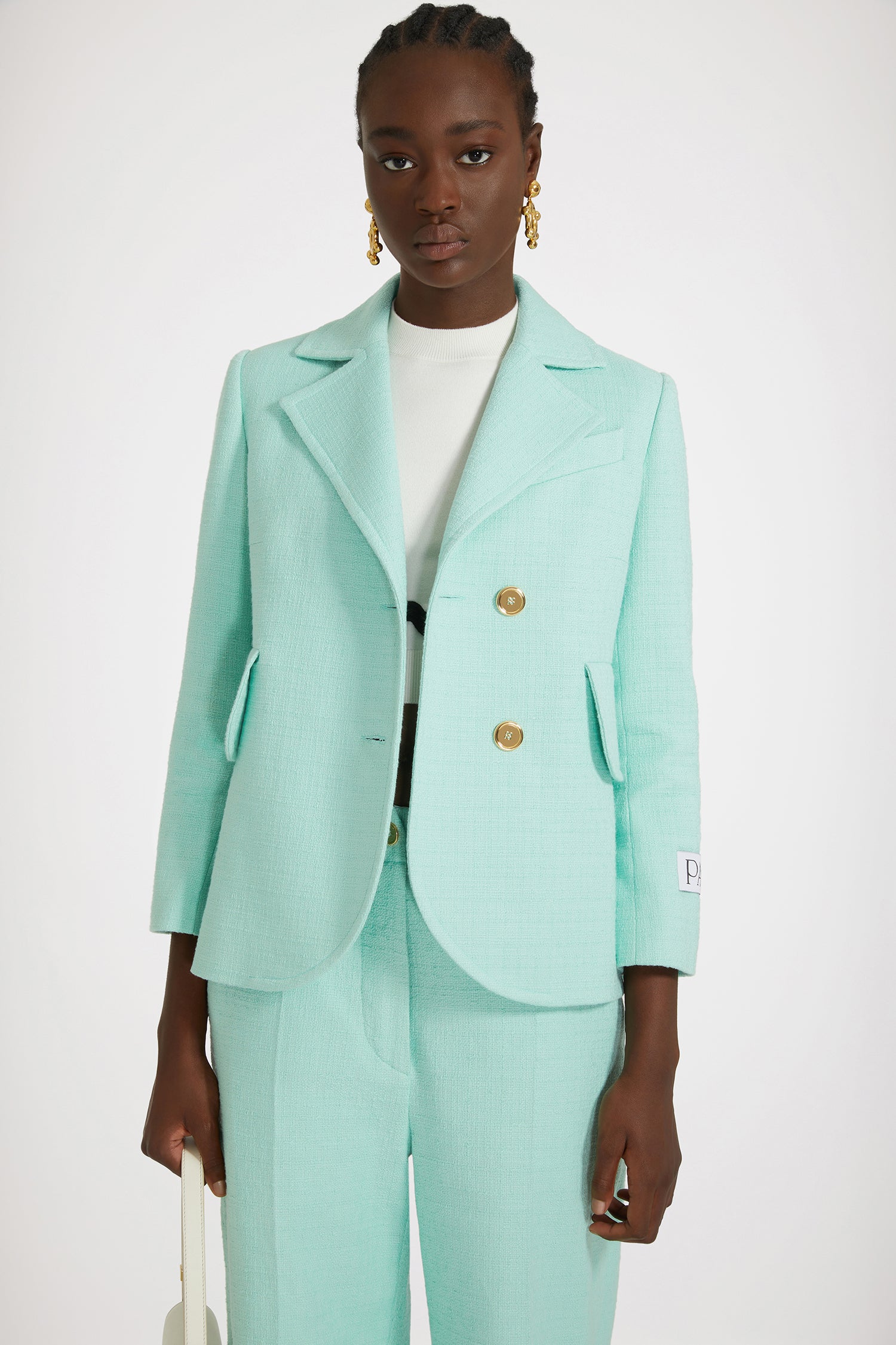 Patou - Tailored jacket in cotton tweed - Mint Green - One perfect tailored jacket, endless possibilities.Mint green cotton tweed jacket. Single-breasted style with off-center placket. Fitted tailored silhouette. Wide notch lapels. Gold-tone Patou-engraved buttons. Flap pockets. Cropped sleeves. Patou label on the left sleeve. Lined.