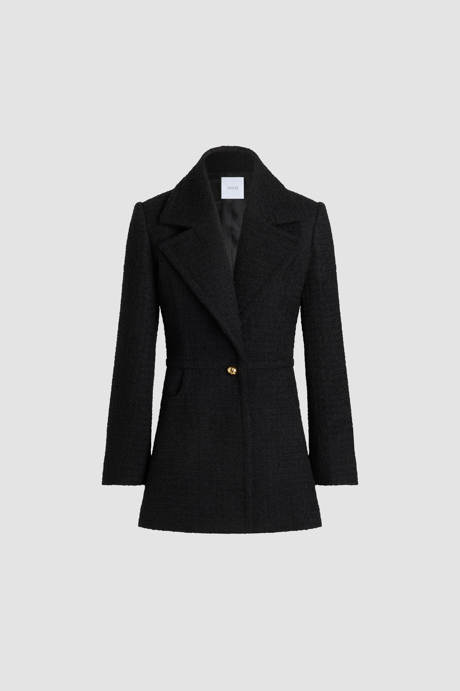 Patou - Longline single-breasted jacket in sustainable wool blend tweed - No Label Black - Black sustainable wool blend tweed jacket. Long tailored silhouette. Single-breasted construction. Wide notch lapel. Single gold-tone half-sphere JP monogram button. Buttoned cuffs. Lined