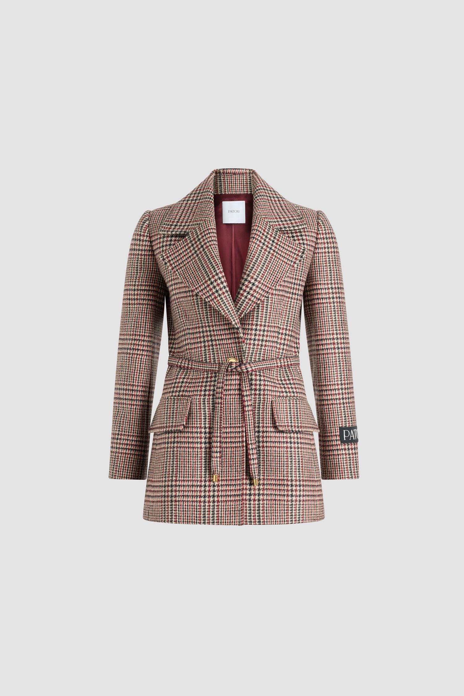 Patou - Longline single-breasted jacket in sustainable wool flannel - Prince Of Wales - Sustainable virgin wool flannel jacket. Prince of Wales pattern. Long tailored silhouette. Single-breasted construction. Wide notch lapel. Single gold-tone JP monogram-engraved button. Removable thin self-tie fabric belt at the waist. Patou logo label on the left sleeve. Buttoned cuffs. Lined.