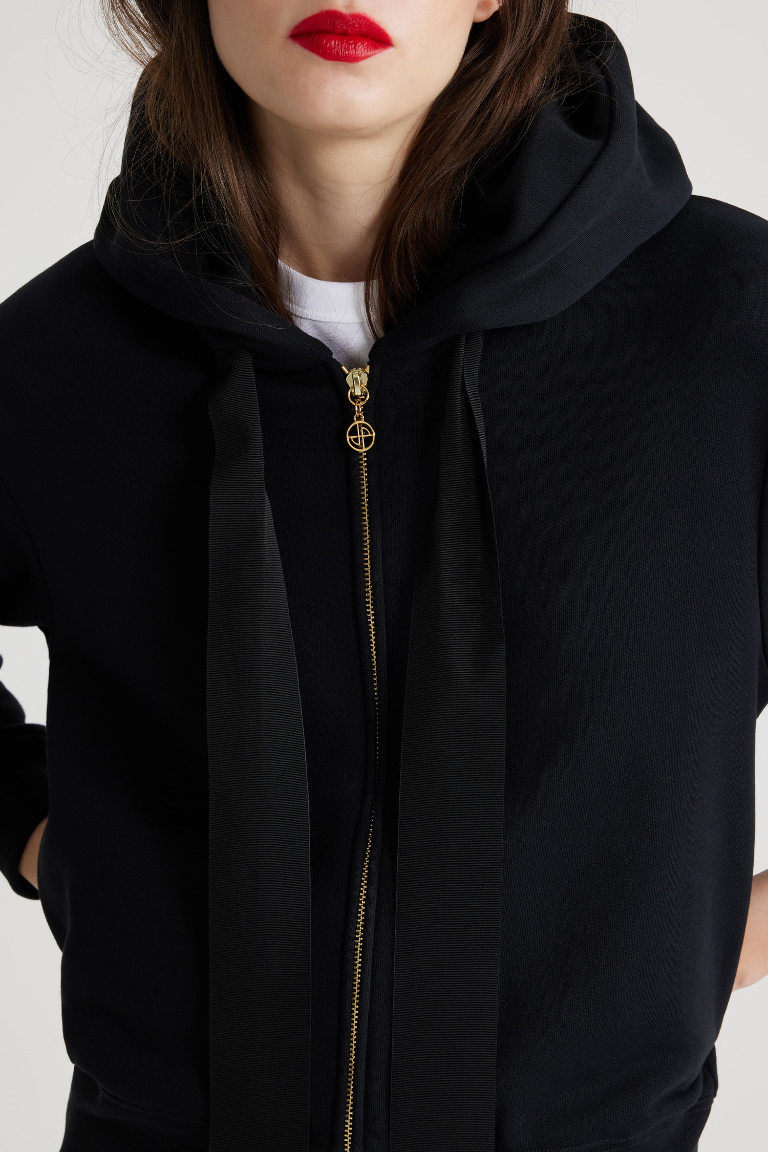 Patou - Organic cotton Patou zip-up hoodie - Black - The girl with the Patou hoodie.Black organic cotton zip up hoodie. Exaggerated grosgrain ties designed to hang loose at the front. Gold-coloured zip with stylised logo pull tab. Lettering logo in white at the back. Ribbed cuffs and waistband.