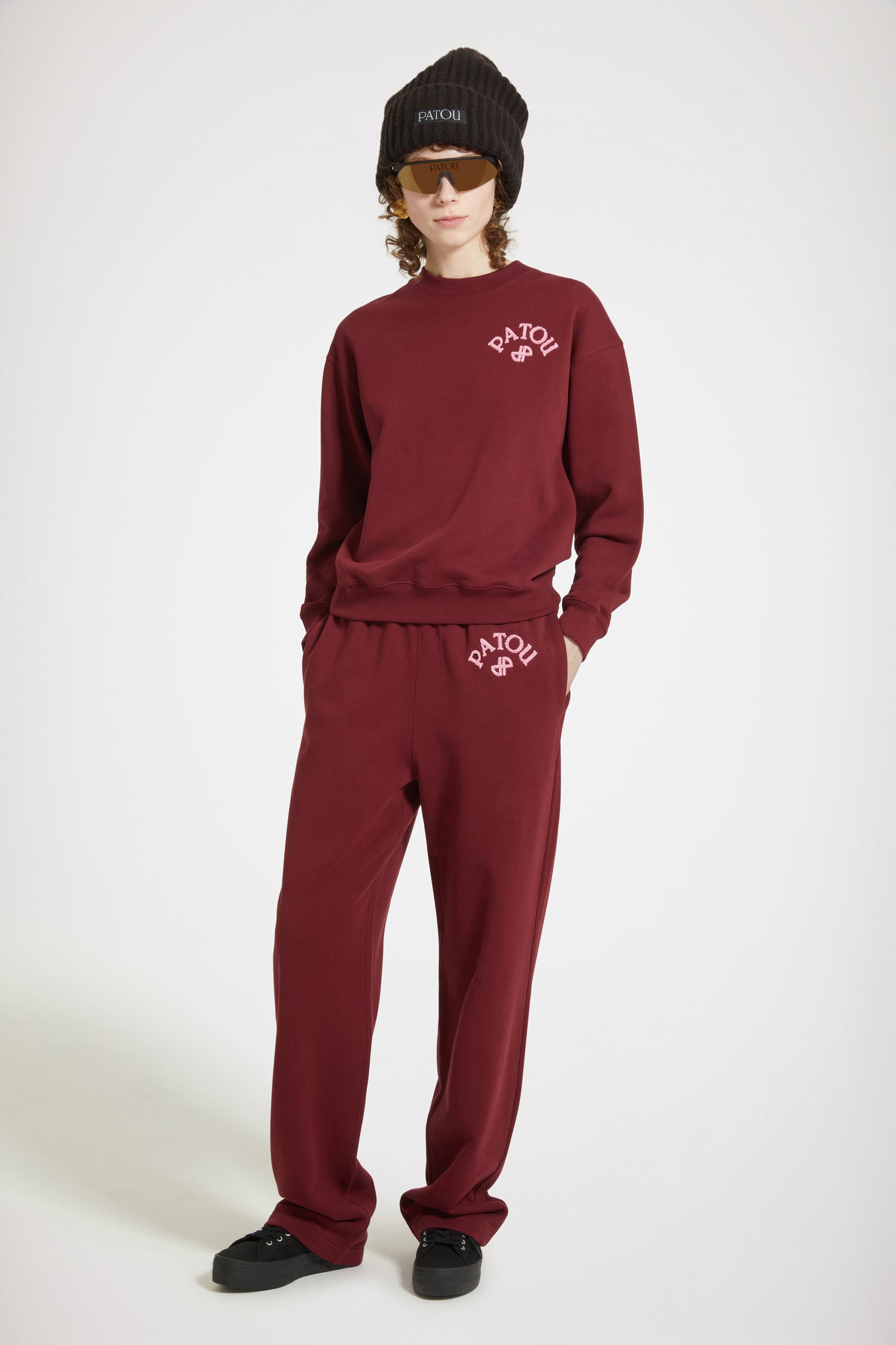 Patou - Bouclette embroidery tracksuit trousers in organic cotton - Ruby Wine - The tracksuit refined and redefined.Ruby Wine organic cotton trousers. High rise. Straight leg. Elasticated waist with hidden herringbone drawstring. 3D mélange bouclette Patou and JP embroidery. Pockets at the sides.Can be worn at the waist or on the hips.