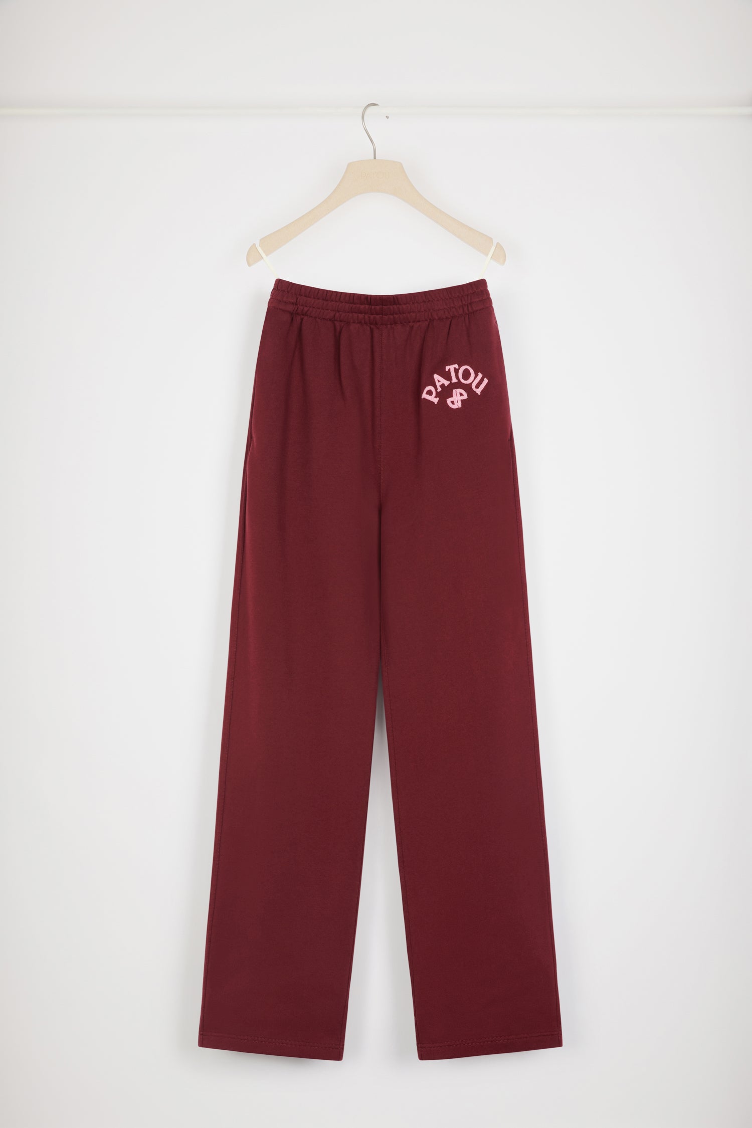 Patou - Bouclette embroidery tracksuit trousers in organic cotton - Ruby Wine - The tracksuit refined and redefined.Ruby Wine organic cotton trousers. High rise. Straight leg. Elasticated waist with hidden herringbone drawstring. 3D mélange bouclette Patou and JP embroidery. Pockets at the sides.Can be worn at the waist or on the hips.