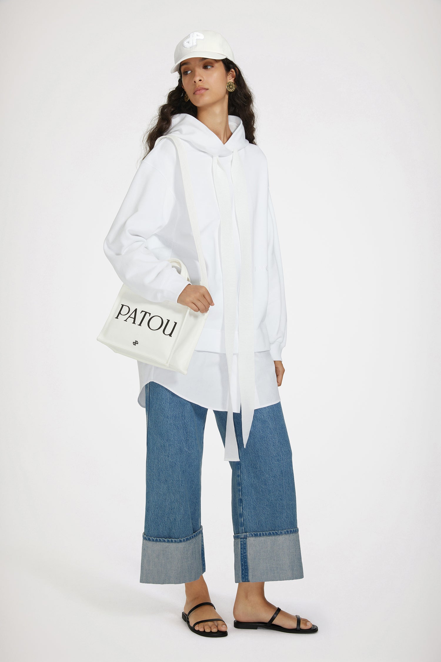 Patou - Trompe l'oeil hoodie dress in organic cotton - White - A trompe l'oeil that's easy on the eye.White organic cotton dress. Mixed fabric style with trompe l'oeil poplin bottom attached to a fleece hoodie. Hooded collar with grosgrain drawstrings. Embroidered Patou at the front. Ribbed cuffs and waist.