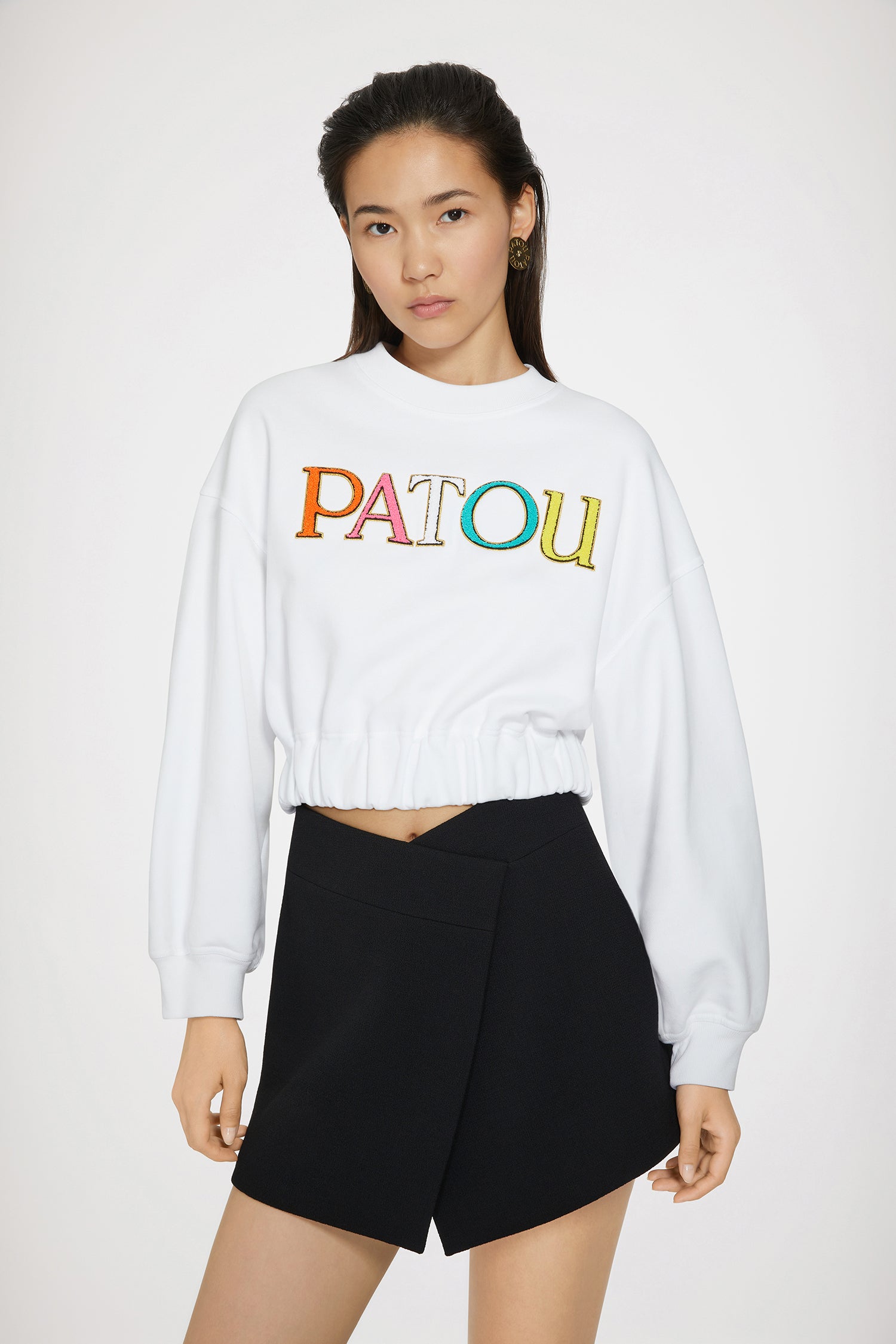 Patou - Patou cropped sweatshirt in organic cotton - White - Wear the Patou rainbow!White organic cotton sweatshirt. Cropped length. Relaxed fit. Crewneck. Ribbed collar and cuffs. Multicoloured bouclette Patou embroidery at the front. Elasticated waist.