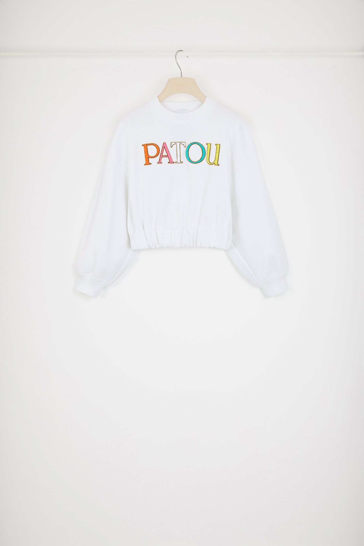 Patou - Patou cropped sweatshirt in organic cotton - White - Wear the Patou rainbow!White organic cotton sweatshirt. Cropped length. Relaxed fit. Crewneck. Ribbed collar and cuffs. Multicoloured bouclette Patou embroidery at the front. Elasticated waist.