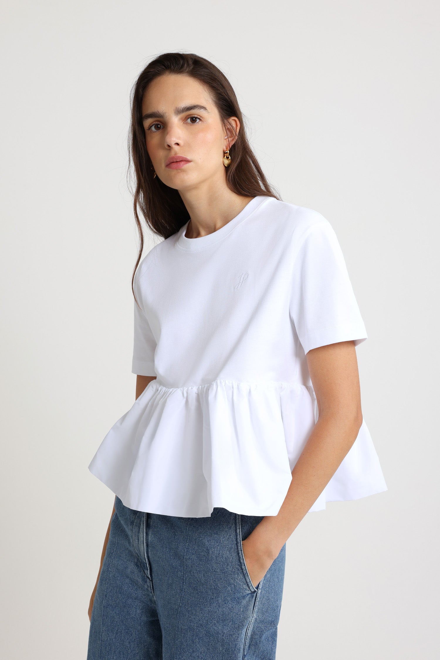 Patou - Ruffle hem t-shirt in organic cotton and faille - White - White organic cotton t-shirt. Thick jersey. Mixed media design with a contrast faille hem. Crewneck. Embroidered JP calligraphy monogram at the chest. Ruching at the waist.