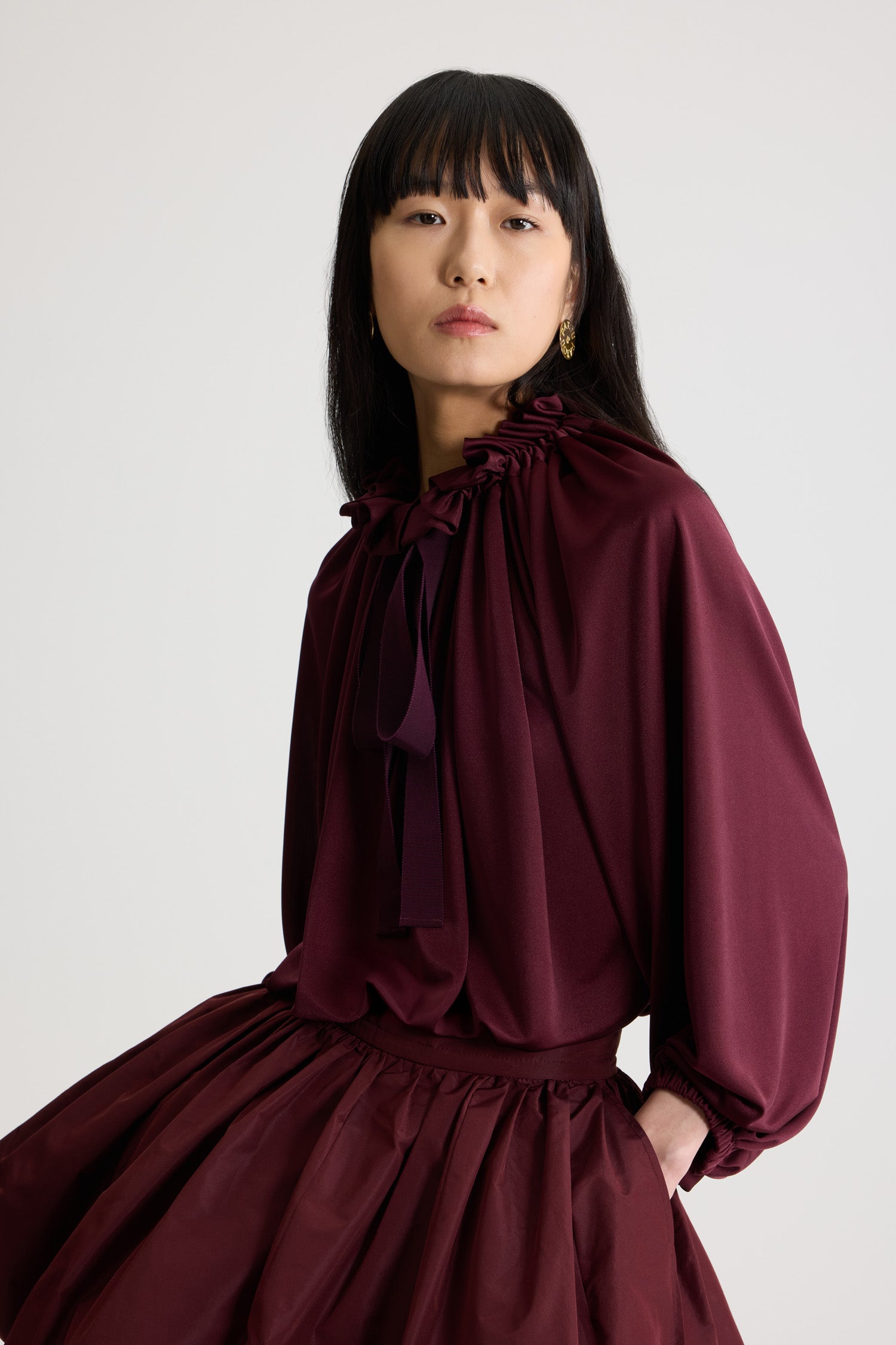 Patou - Iconic drawstring top in satin jersey - Vignola - Vignola maroon satin jersey top. Drawstring collar with flounce at the front and long grosgrain ties. Batwing sleeves with elasticated cuffs. Elasticated waist.