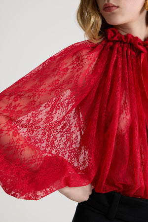 Top iconico con coulisse in jersey di pizzo