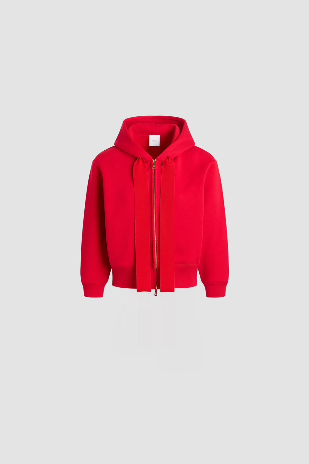 Patou - Patou logo and JP monogram zip-up hoodie in organic cotton fleece - Scarlet Red - Scarlet Red organic cotton fleece hoodie. Hooded collar with grosgrain drawstring. Gold-tone zip at the front. Embroidered Patou logo and JP monogram at the back. Side pockets. Ribbed cuffs and hem.