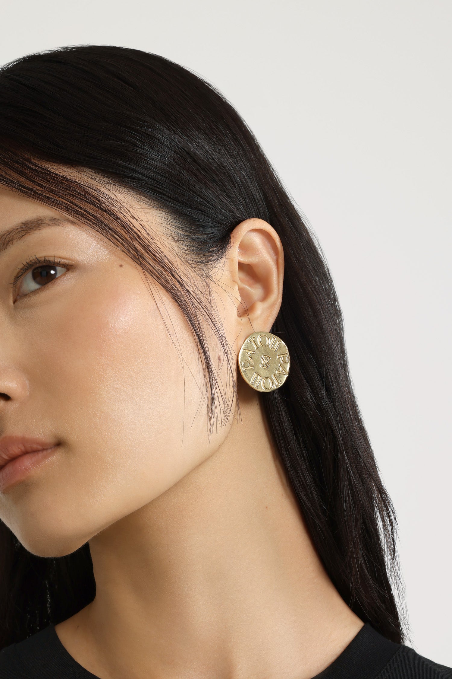 Patou - Coin earrings in gold-plated brass - Gold - Gold-plated brass earrings. Antique coin inspiration. Hammered texture. Engraved Patou logo with JP monogram at the center. Push-back closure.Clip-on version also available.