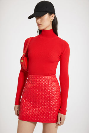 Maglia a costine con collo alto