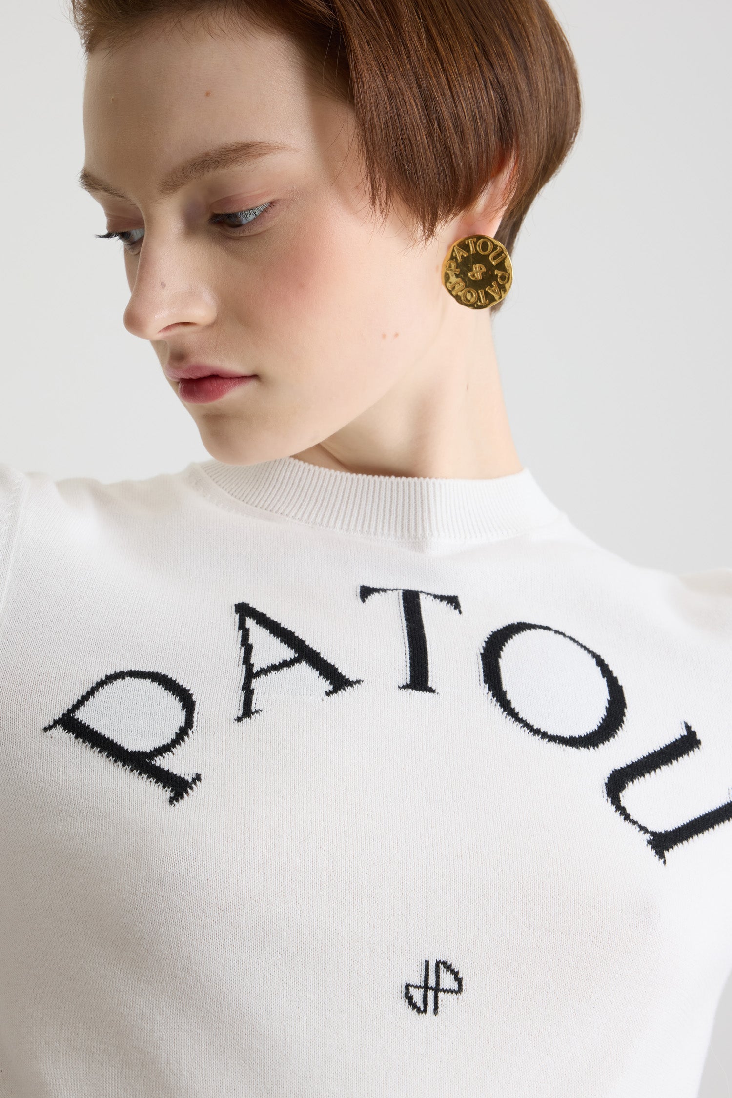 Patou - Patou jacquard knit top in eco-friendly cotton blend - White - Patou, the five letters behind a new style tribe.White organic cotton blend knit top. Fitted style with short sleeves. Round neckline. Ribbed collar, cuffs and waist. Patou lettering logo and monogram jacquard in black at the front.