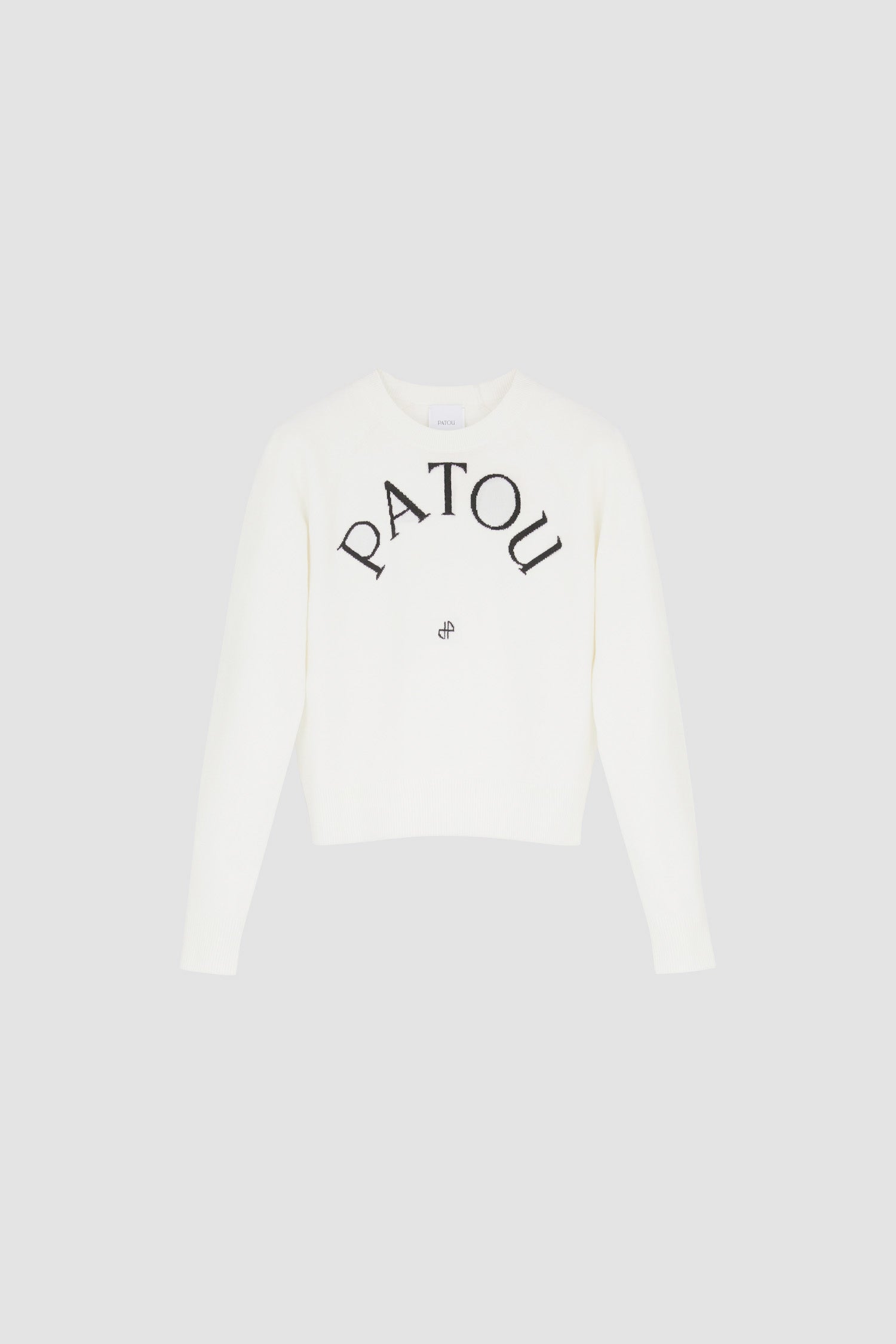 Patou - Pull Patou en laine mélangée - White - La maille Patou mise sur le minimalisme.Pull en laine mérinos mélangée blanche. Col rond. Patou et monogramme noirs en jacquard sur le devant.