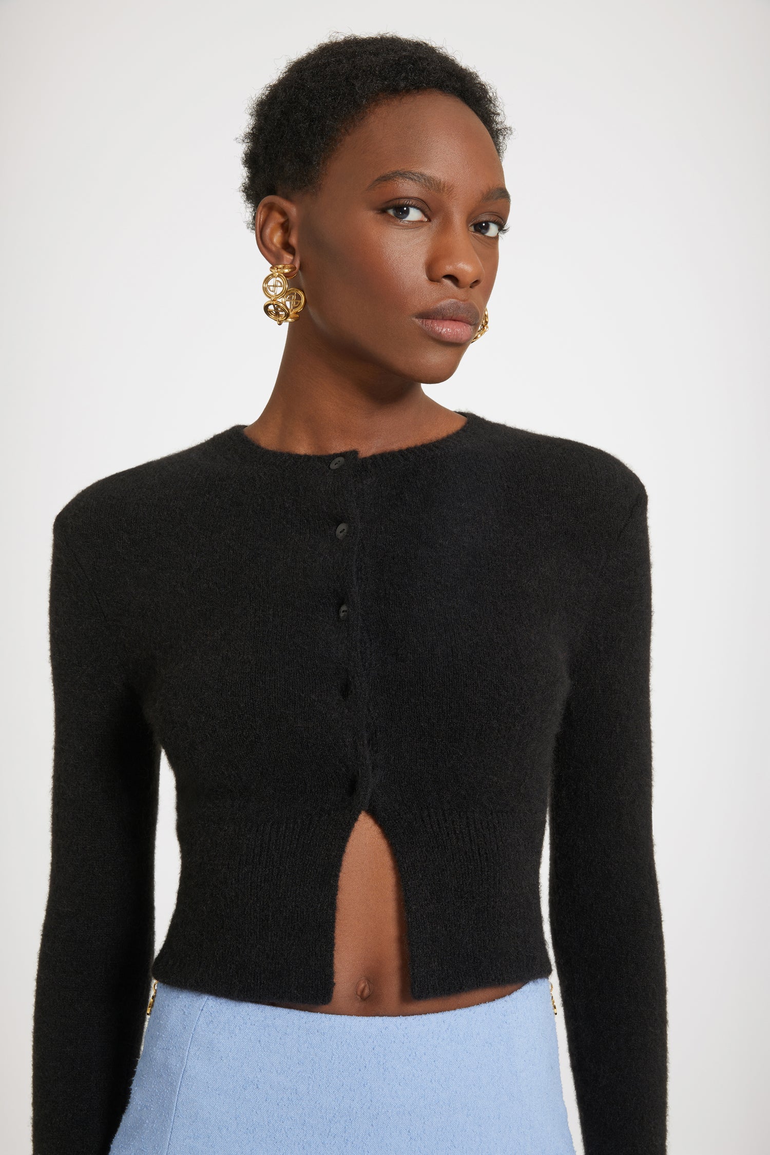 Patou - Cropped cardigan in sustainable alpaca blend - Black - Say oui to the cardi.Black baby alpaca blend cardigan. Fitted cropped silhouette. Round neckline. Ribbed collar, cuffs and waist. JP-engraved mother-of-pearl buttons.This cardigan is very fitted.