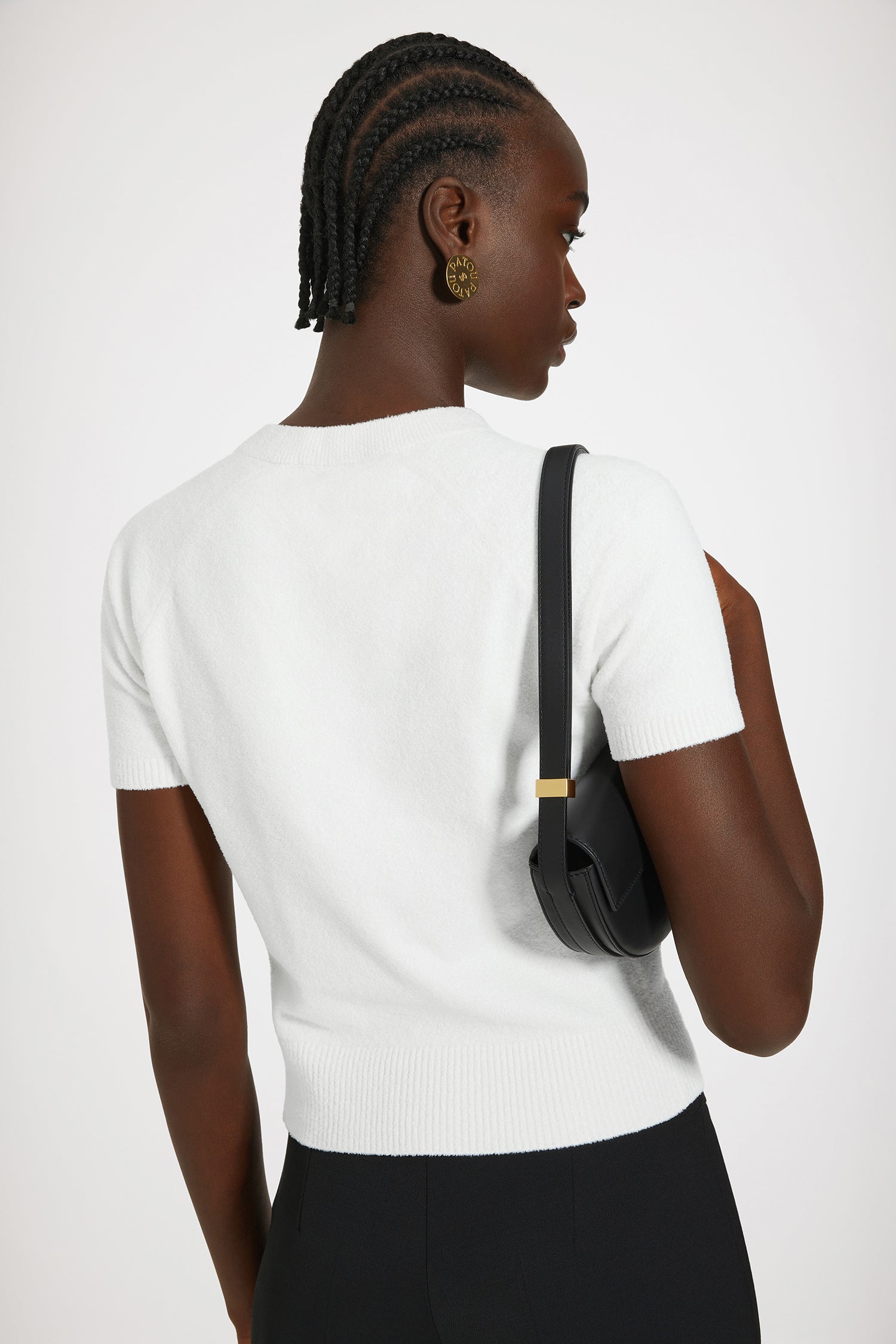 Patou - Top Patou in misto cotone - White - Patou: cinque lettere per scrivere la nuova eleganza.Top in misto cotone bianco. Maglia a spugna. Collo tondo. Collo, polsini e orlo a costine. Maniche corte. Patou e JP in jacquard sul davanti.