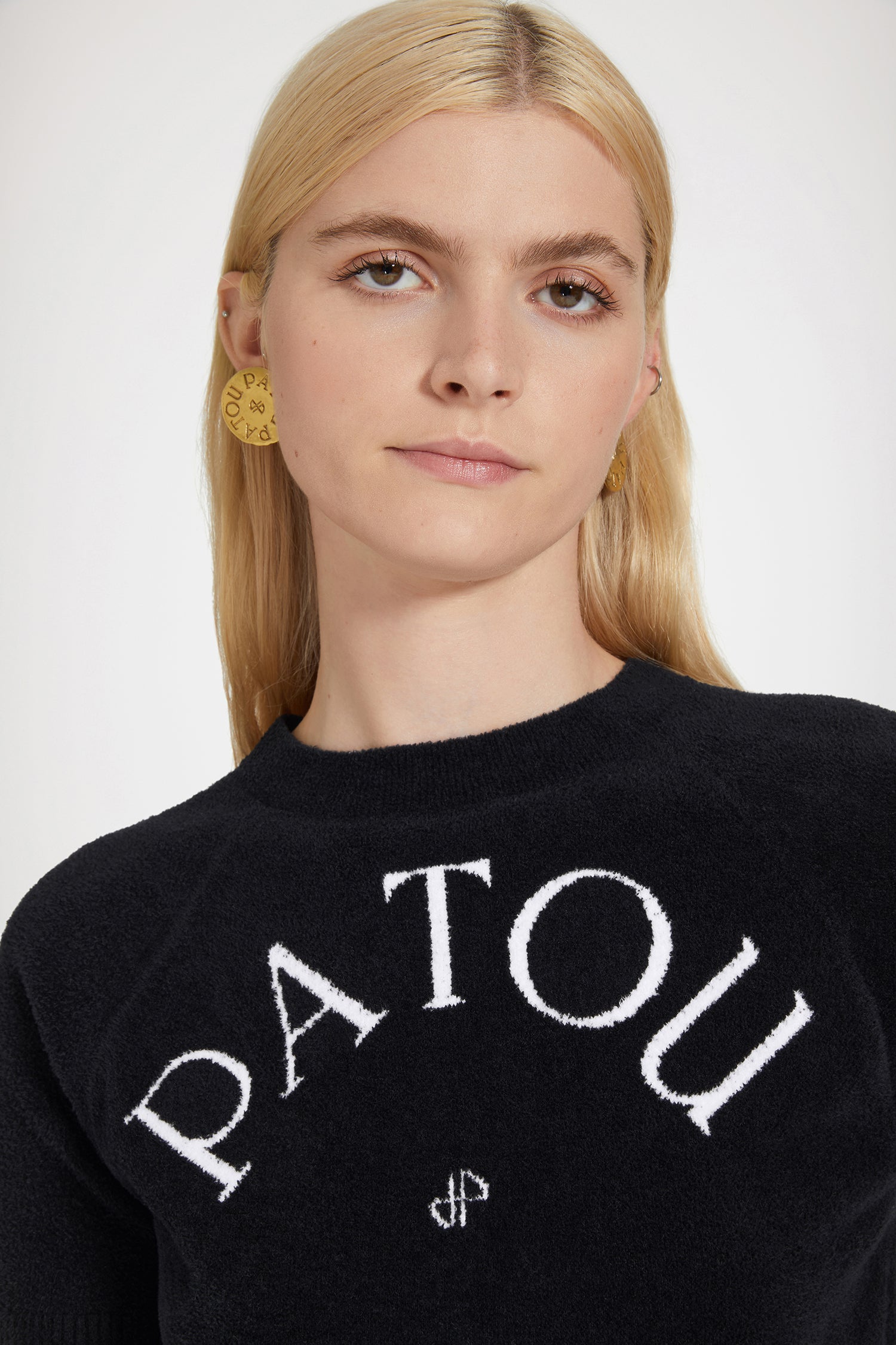 Patou - Patou jacquard knit top in cotton blend - Black - Patou, the five letters behind a new style tribe.Black cotton blend top. Terry knit. Round neck. Ribbed collar, cuffs and hem. Short sleeves Patou lettering logo and monogram jacquard at the front.